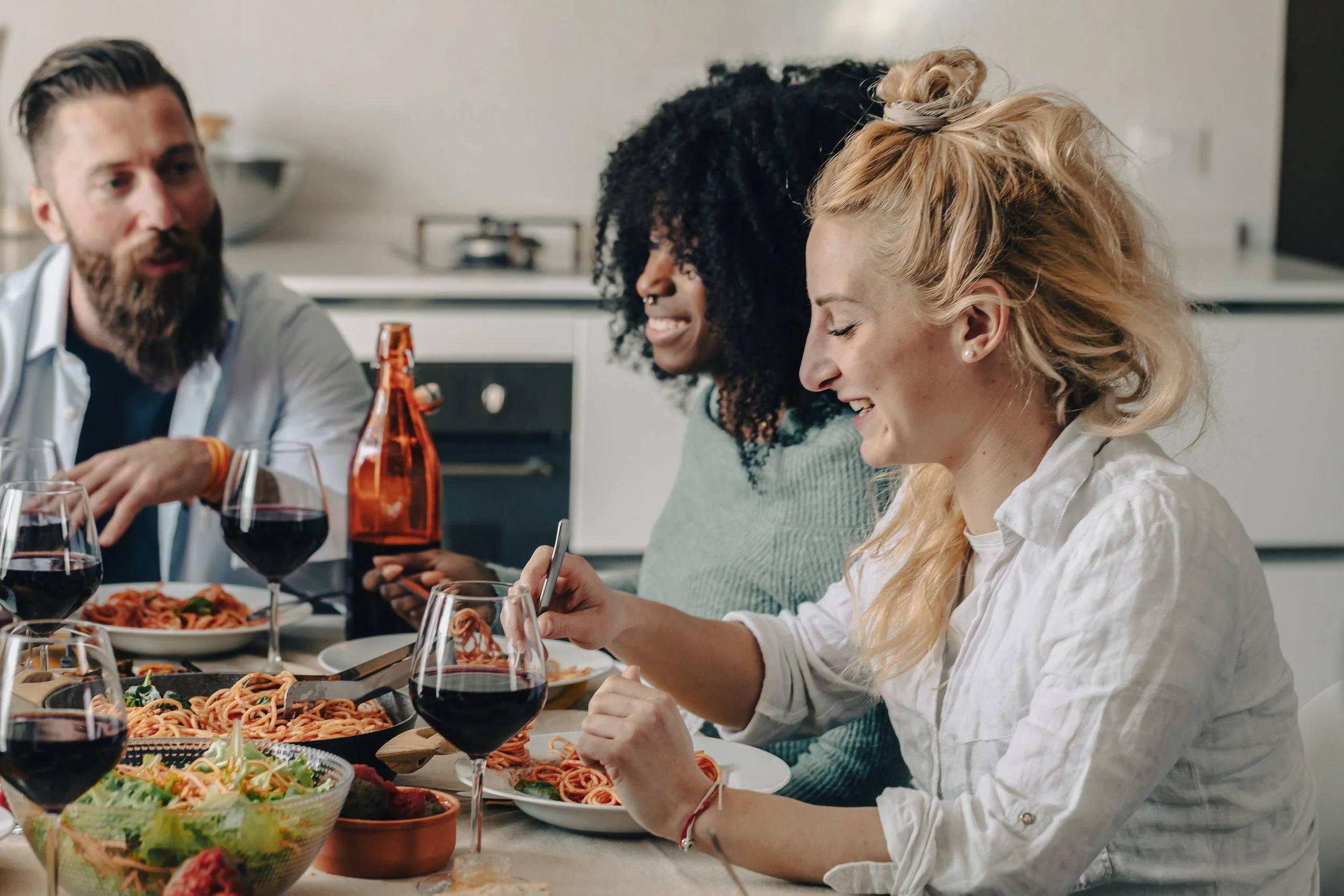 Friends and Family enjoying dinner knowing they're covered with renters insurance through Gerald Bailey Insurance