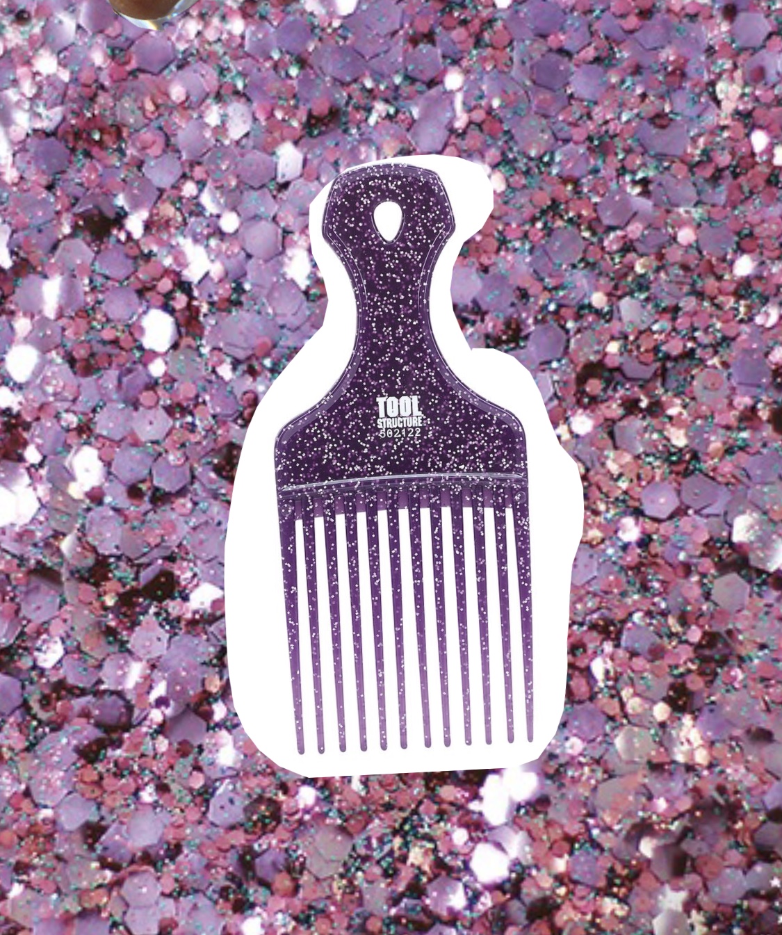 heavy-duty hair pick I bought mine at Sally's Beauty Supply. It is cheap, easy to throw in your bag, and doesn't snap in half no matter how many times I yank at my tangled ends. I fully comb through my hair after I have showered and applied the Milkshake leave-in conditioner.