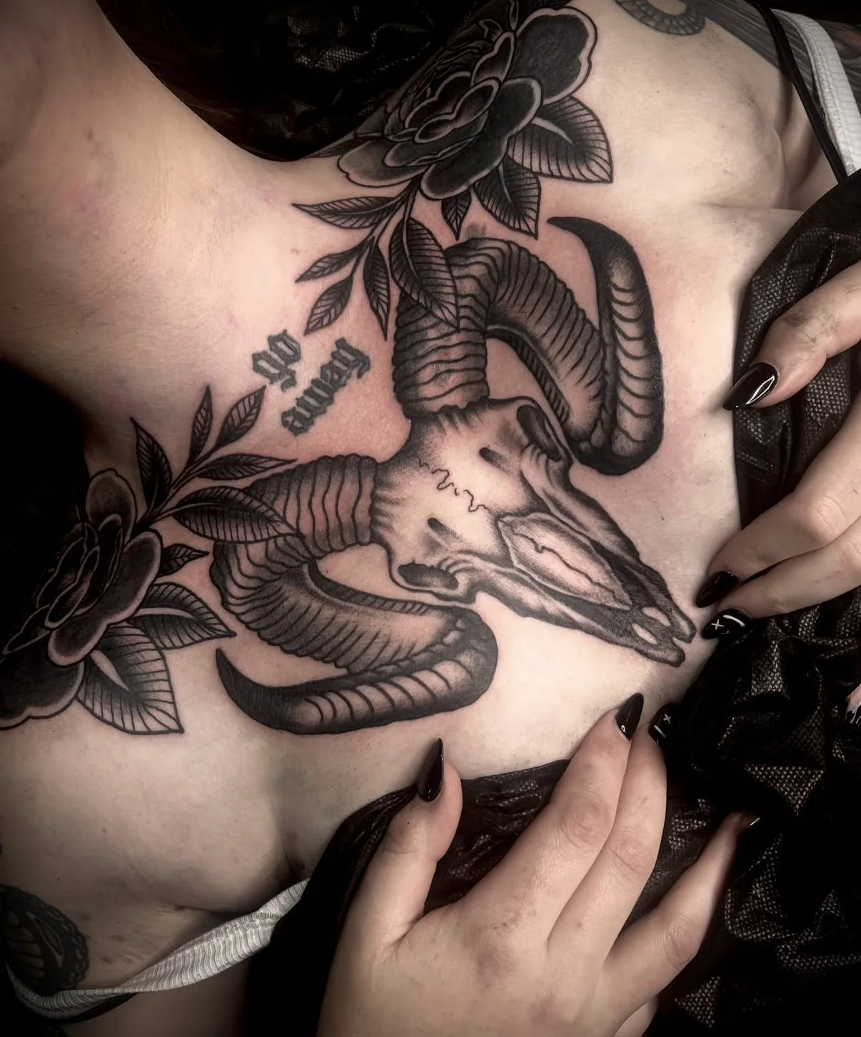 skull chest black and grey tattoo