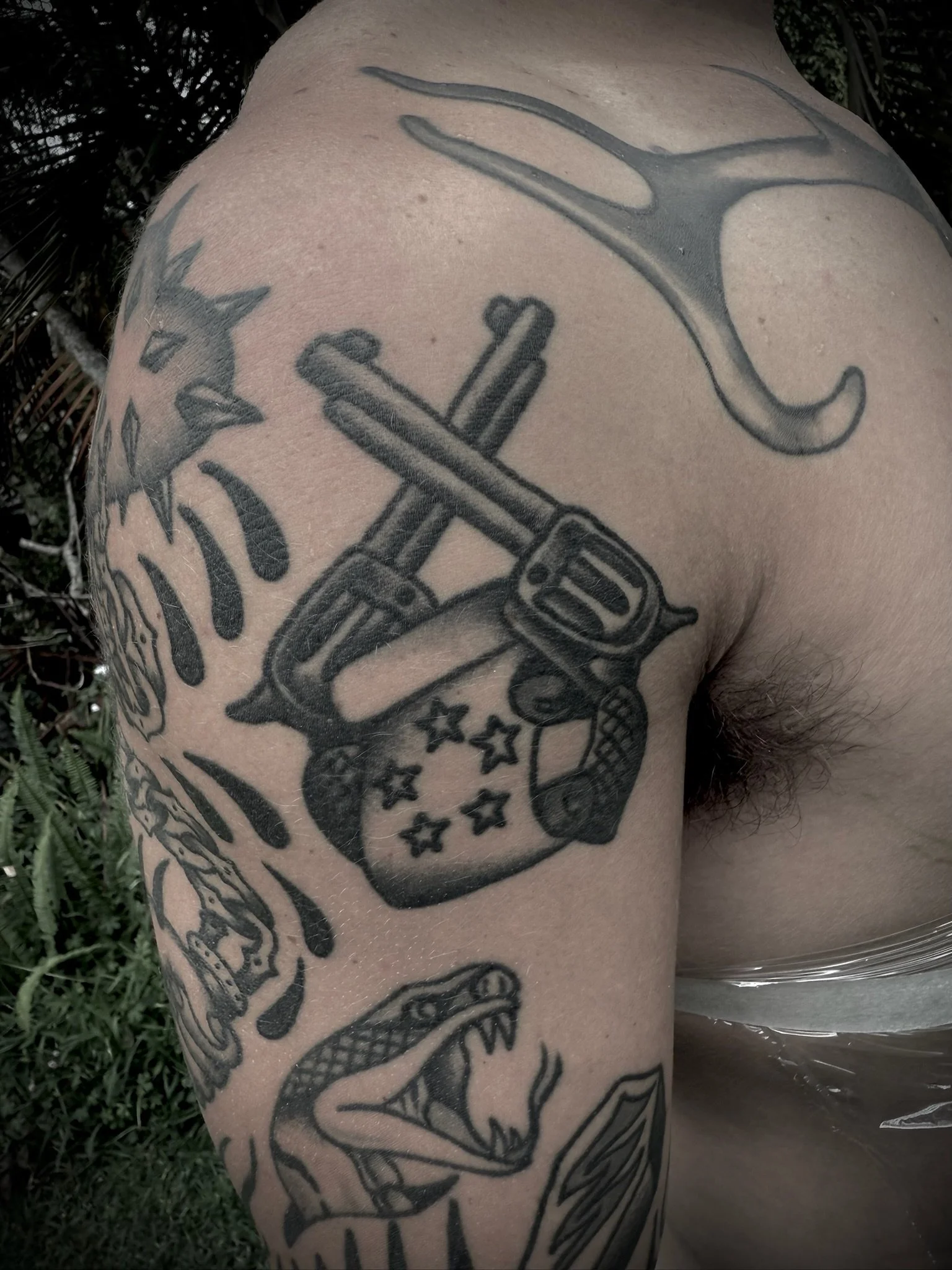 traditional black and grey arm tattoo