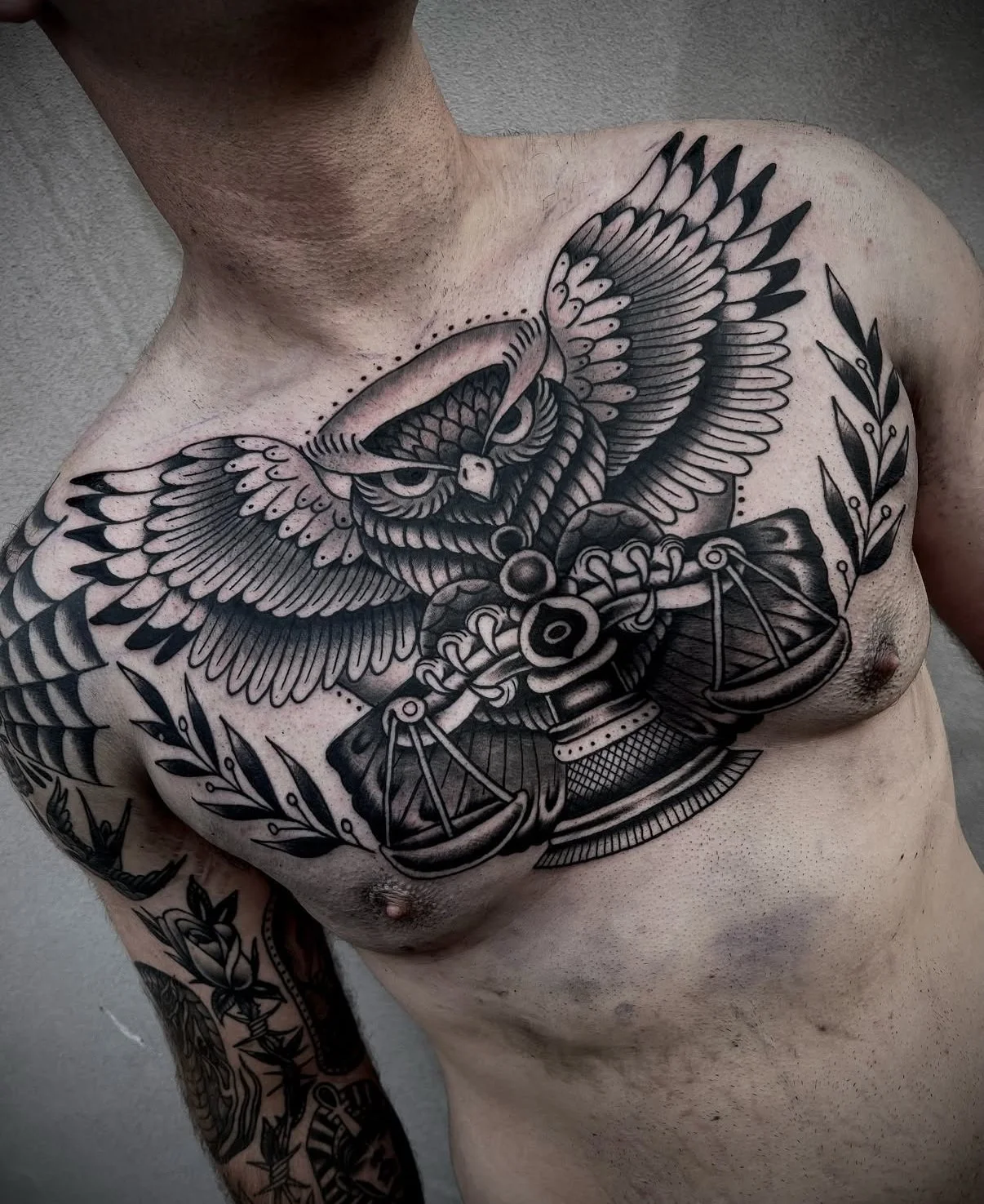traditional owl chest tattoo black and grey