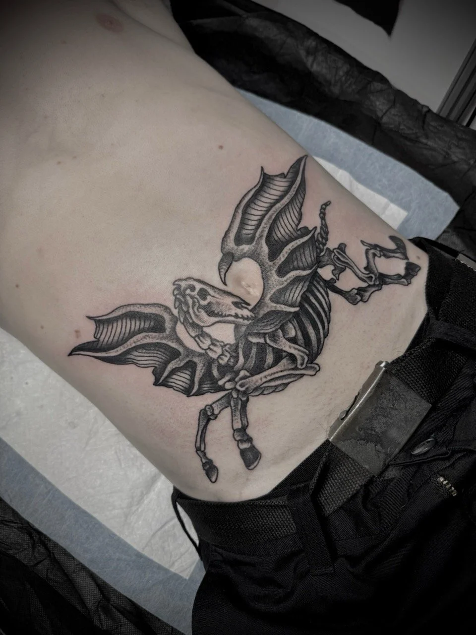 traditional skeleton unicorn tattoo