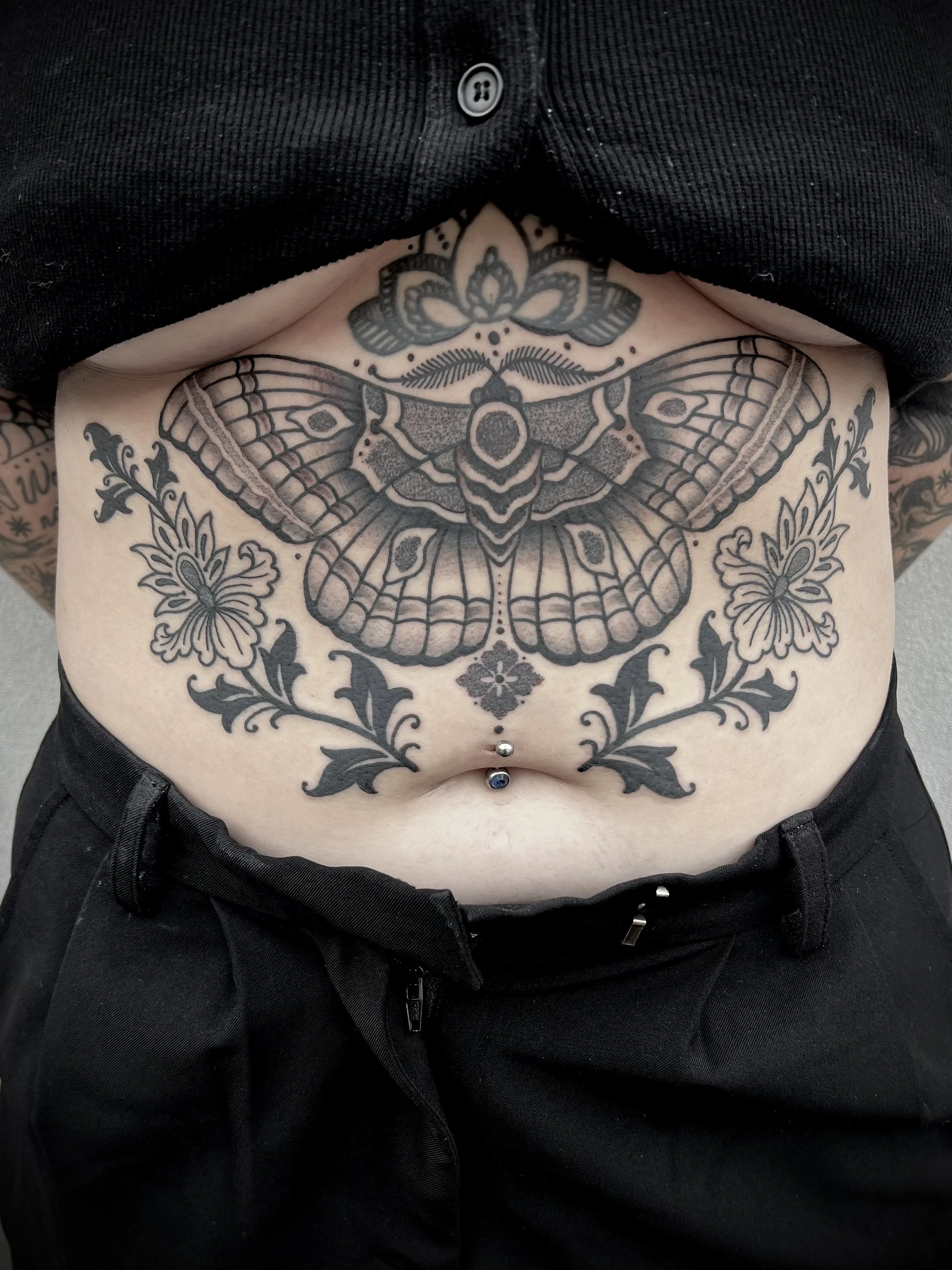 moth stomach tattoo