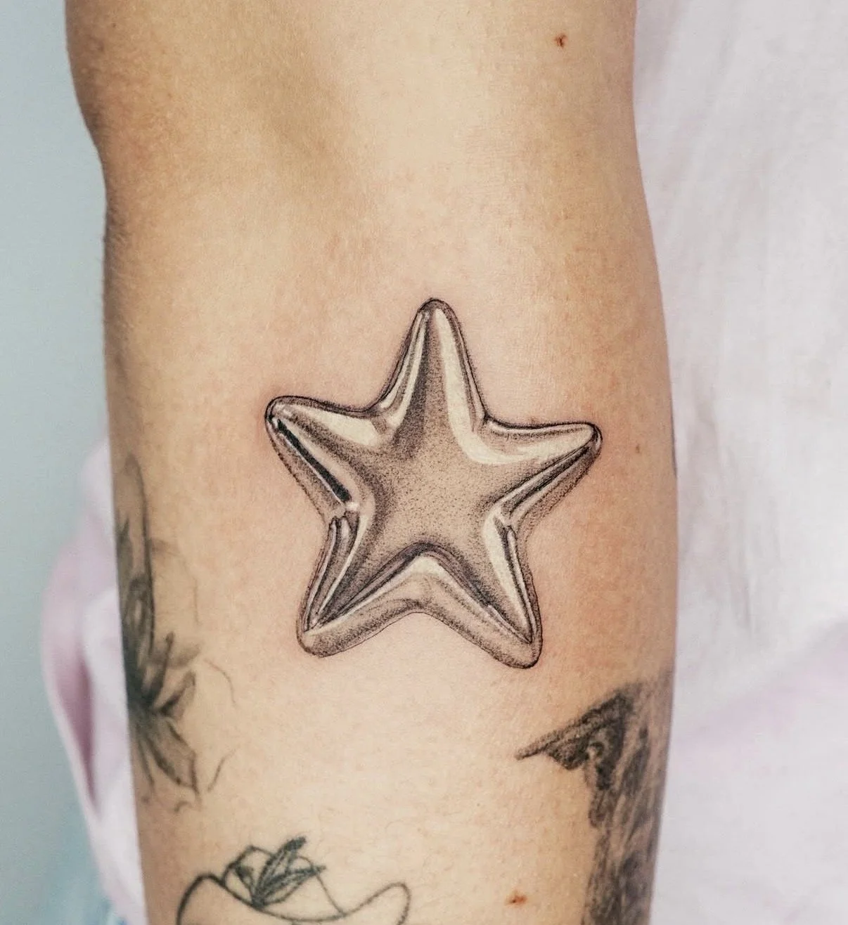 micro realism chrome star tattoo central coast tattoo studio new south whales australia