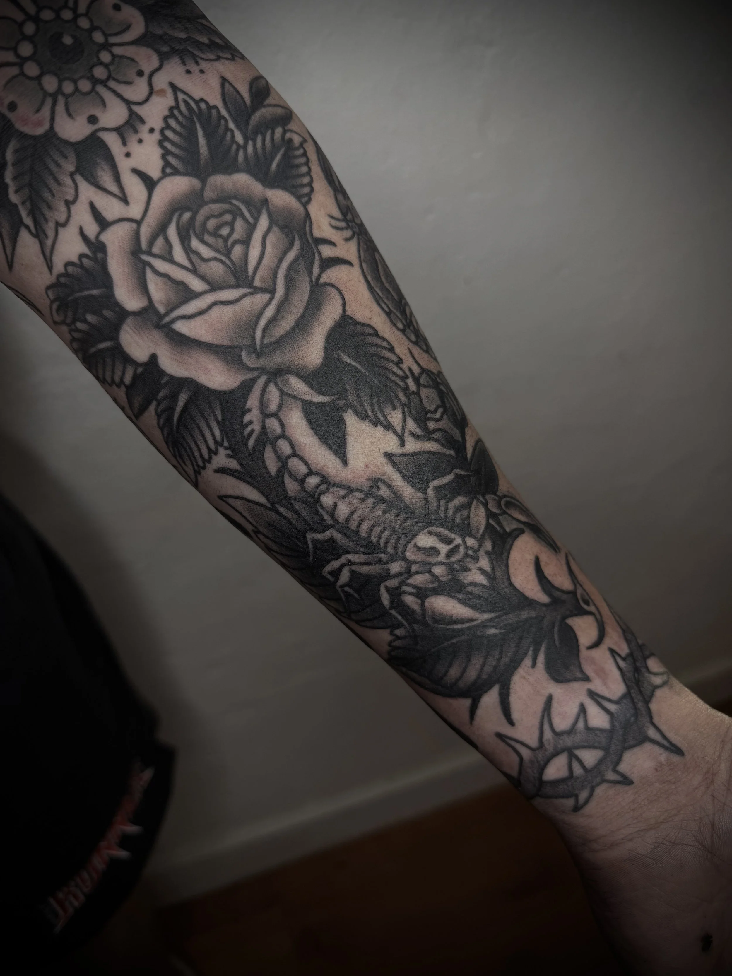 traditional black and grey bold tattoo on forearm central coast tattoo studio australia