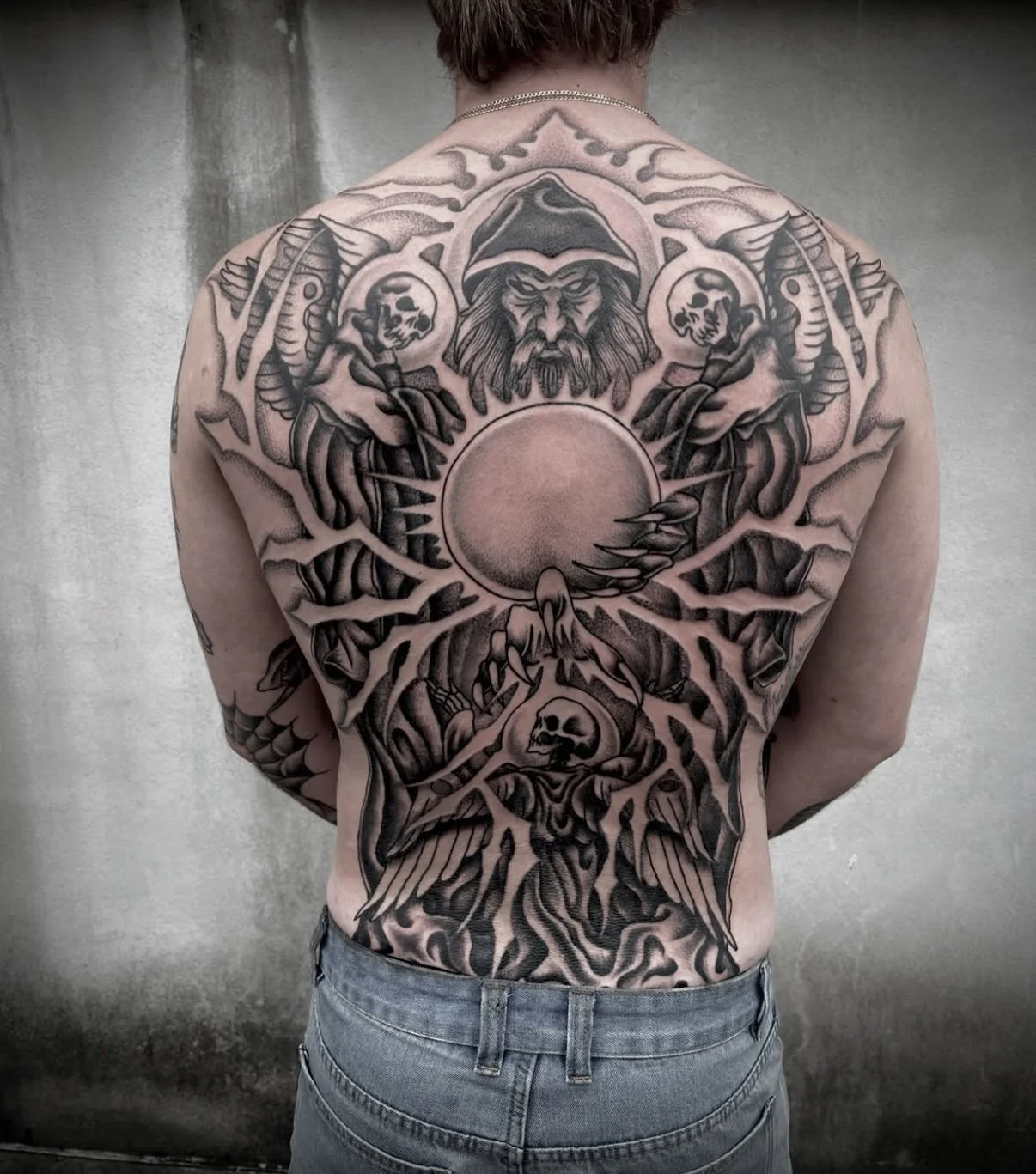 traditional wizard back piece tattoo