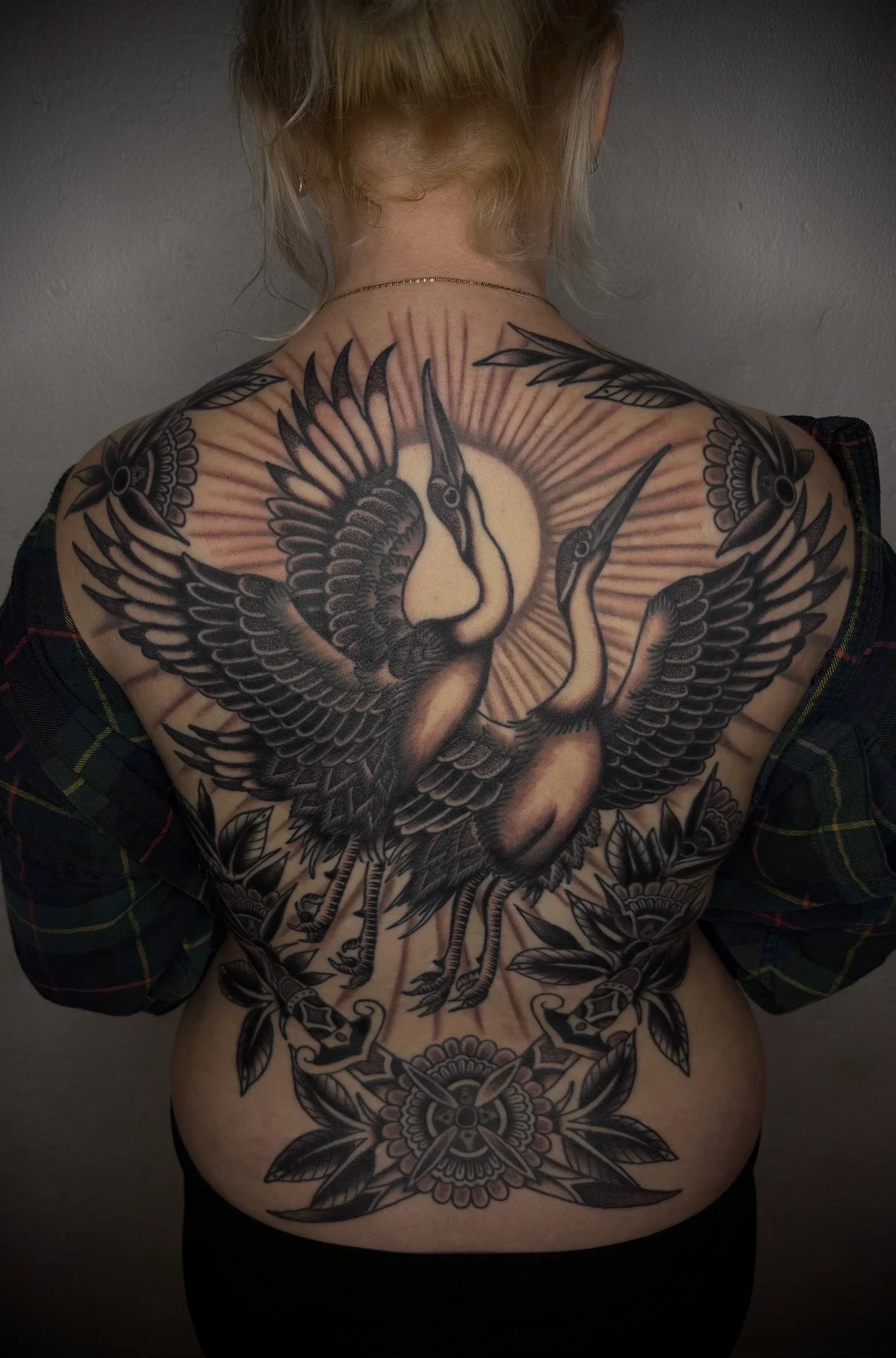 black and grey full back tattoo cranes with flowwers and sun