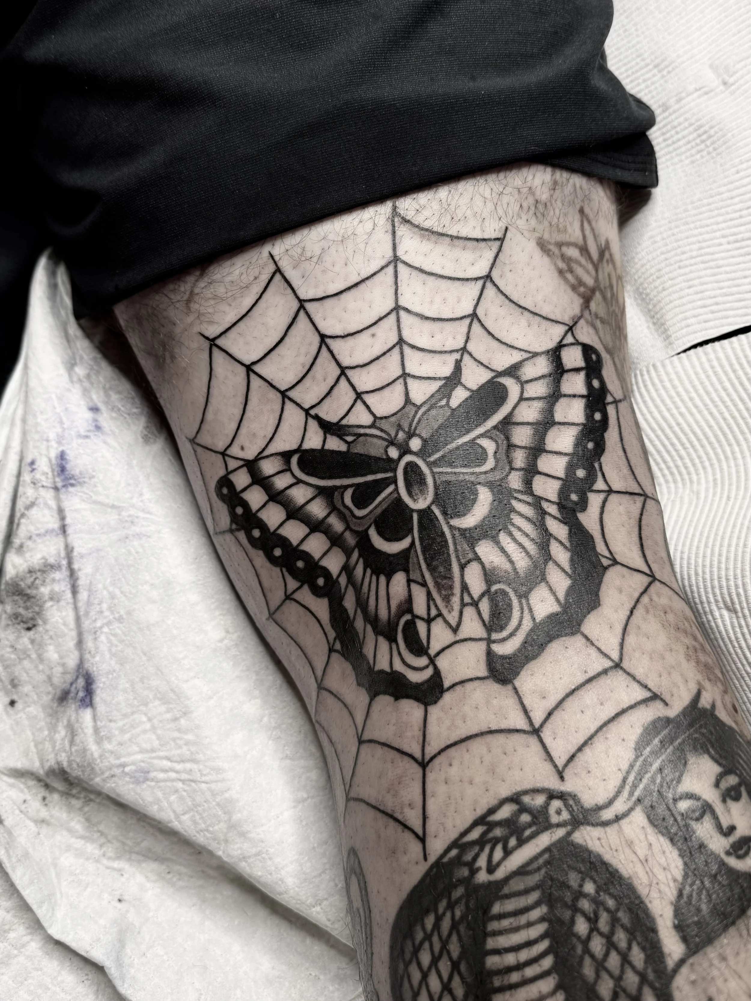traditional butterfly back leg tattoo