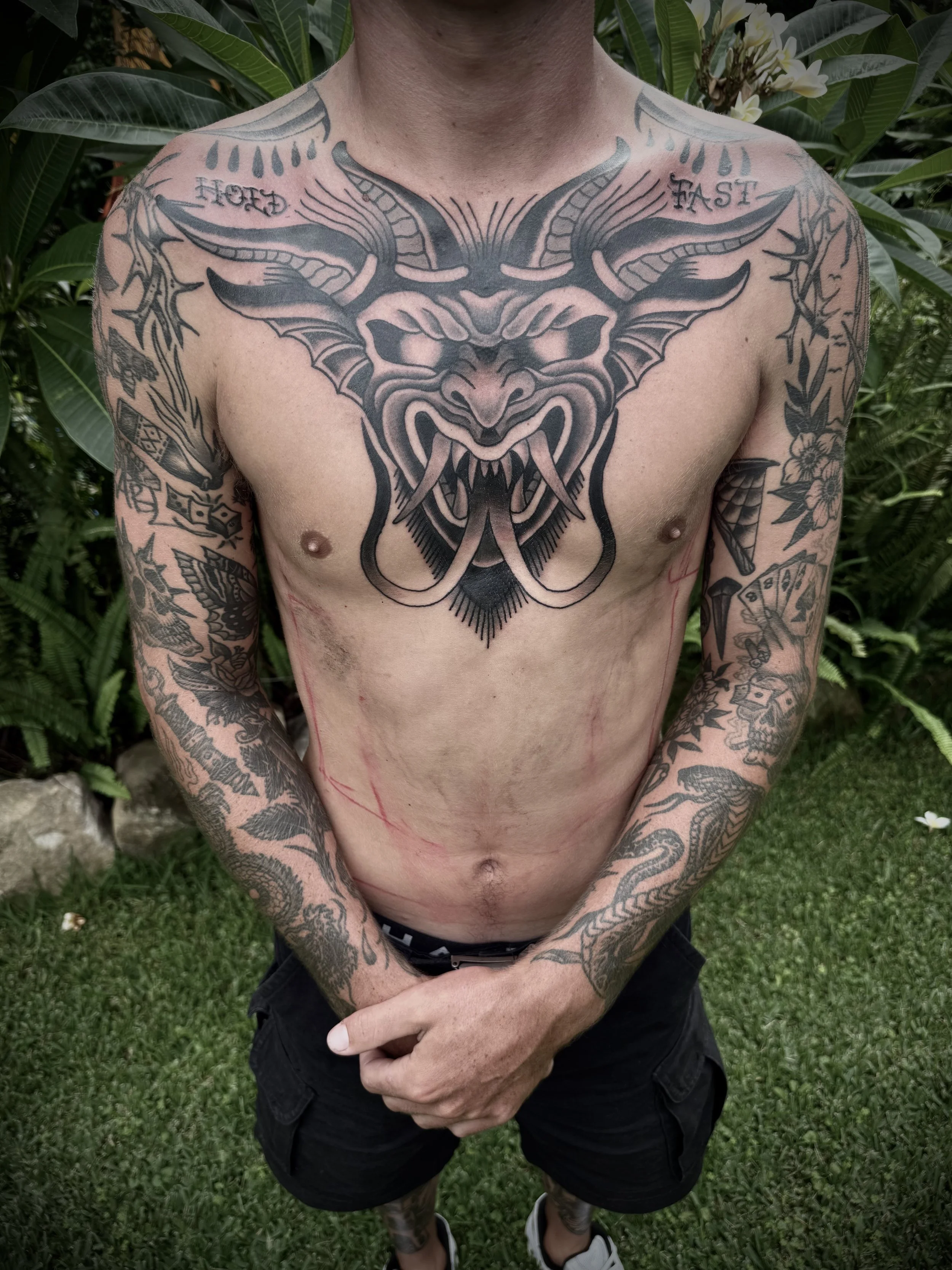 traditional demon chest tattoo black and grey