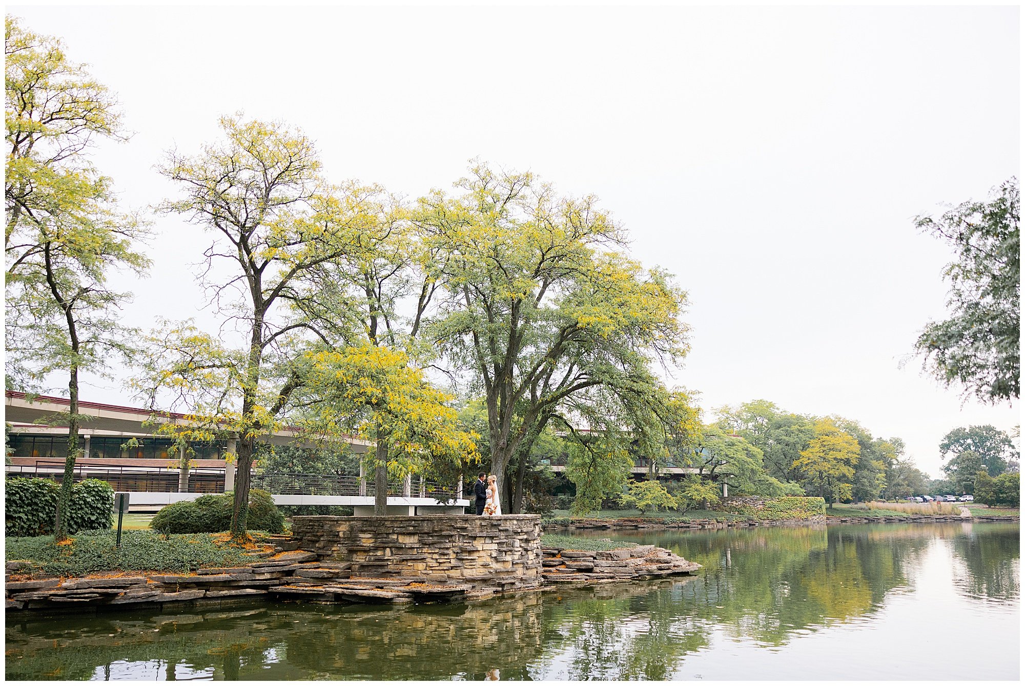  Wedding couple portraits on lake at Hyatt Lodge in Oak Brook Illinois 