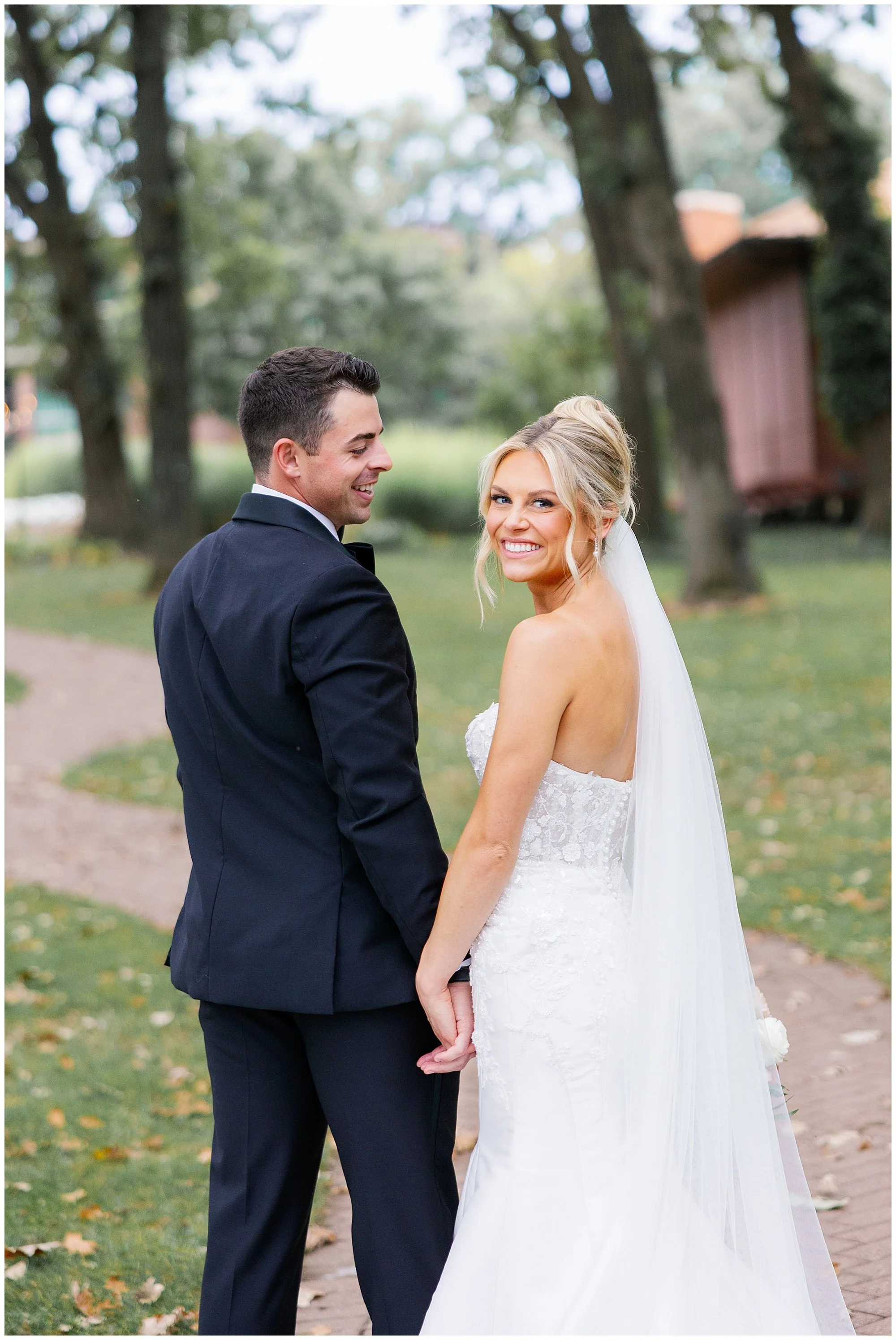  Bride and groom walking outside Hyatt Lodge wedding venue Chicago suburbs 