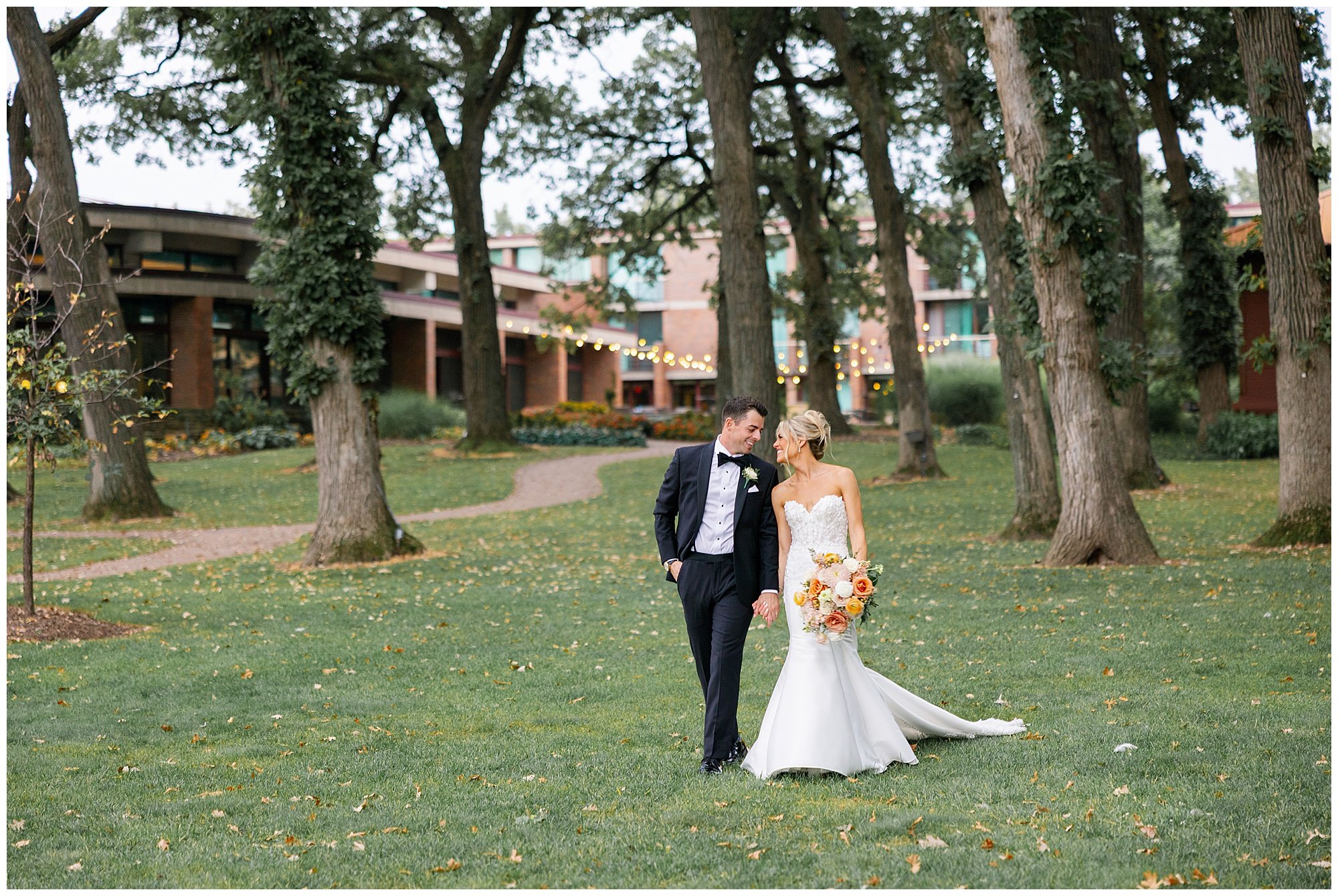  Bride and groom walking outside Hyatt Lodge wedding venue 