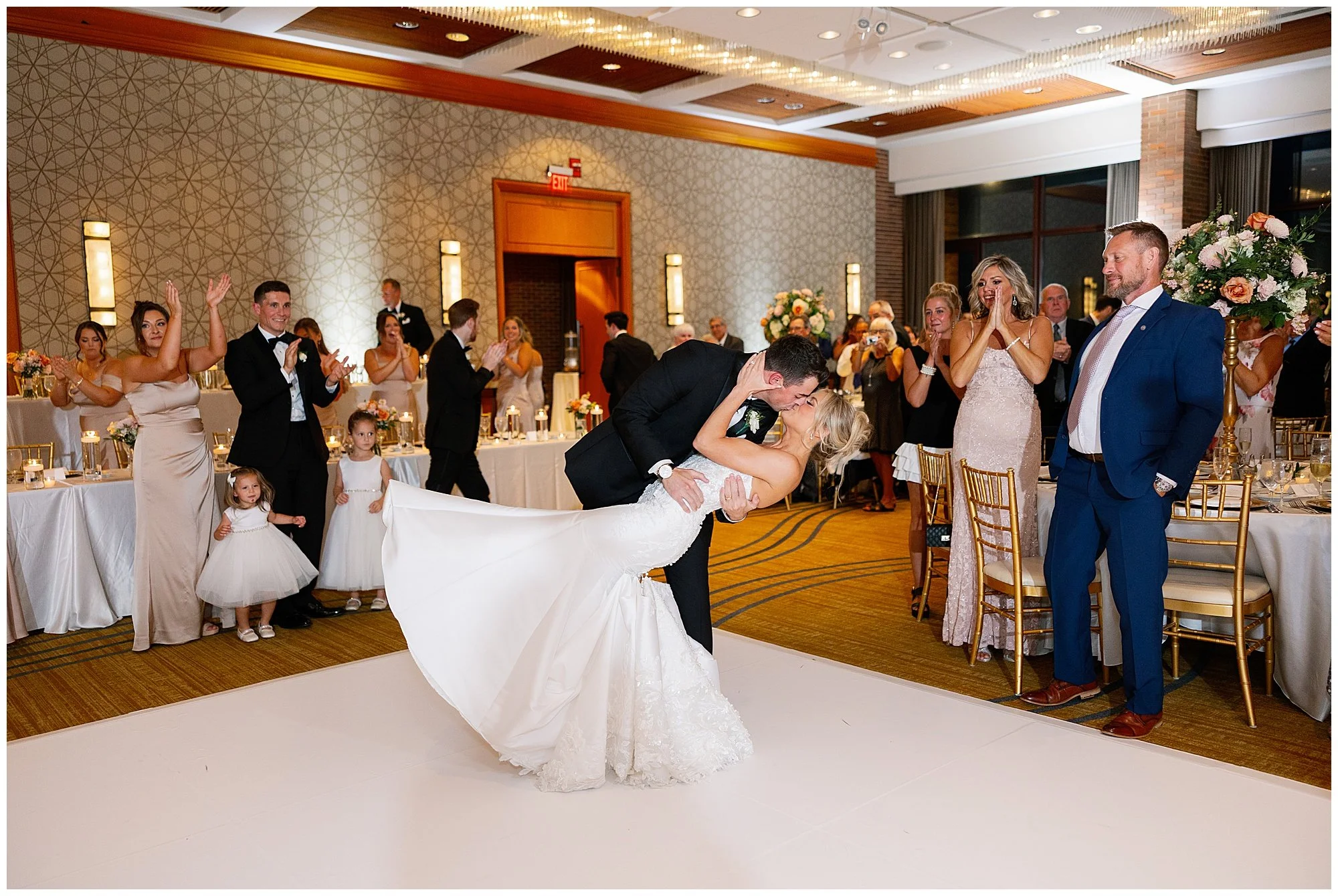  Newlyweds entering wedding reception at Hyatt Lodge Oak Brook Illinois 