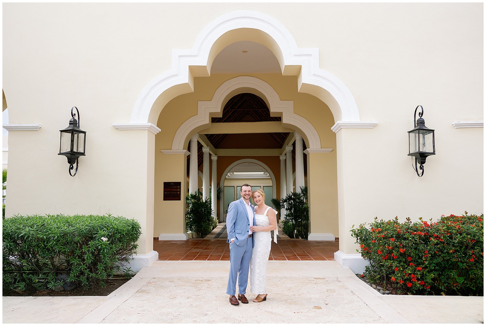  bride and groom under archway at valentin imperial resort in riviera maya 