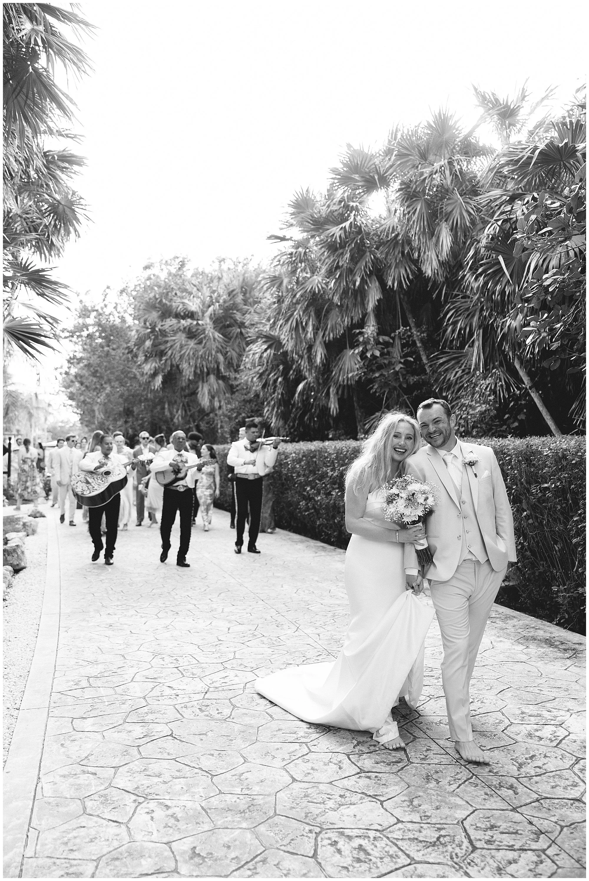  bride and groom in front of mariachi band at valentin imperial resort in riviera maya 