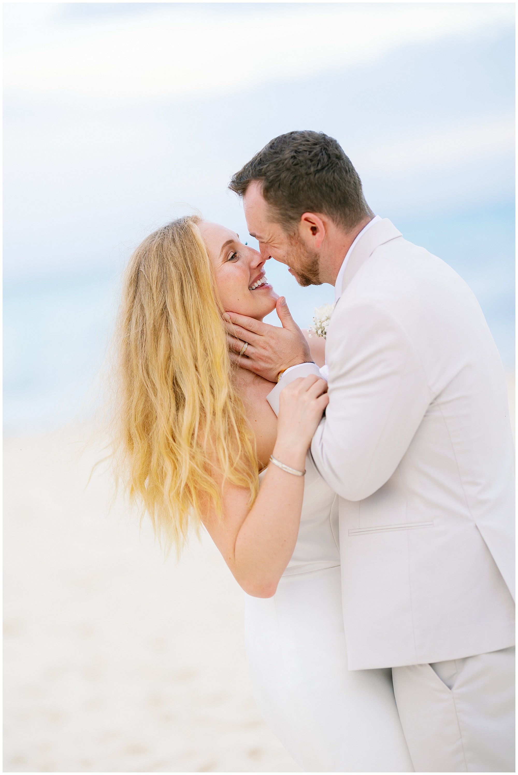  bride and groom kissing on the beach at valentin imperial resort in riviera maya 