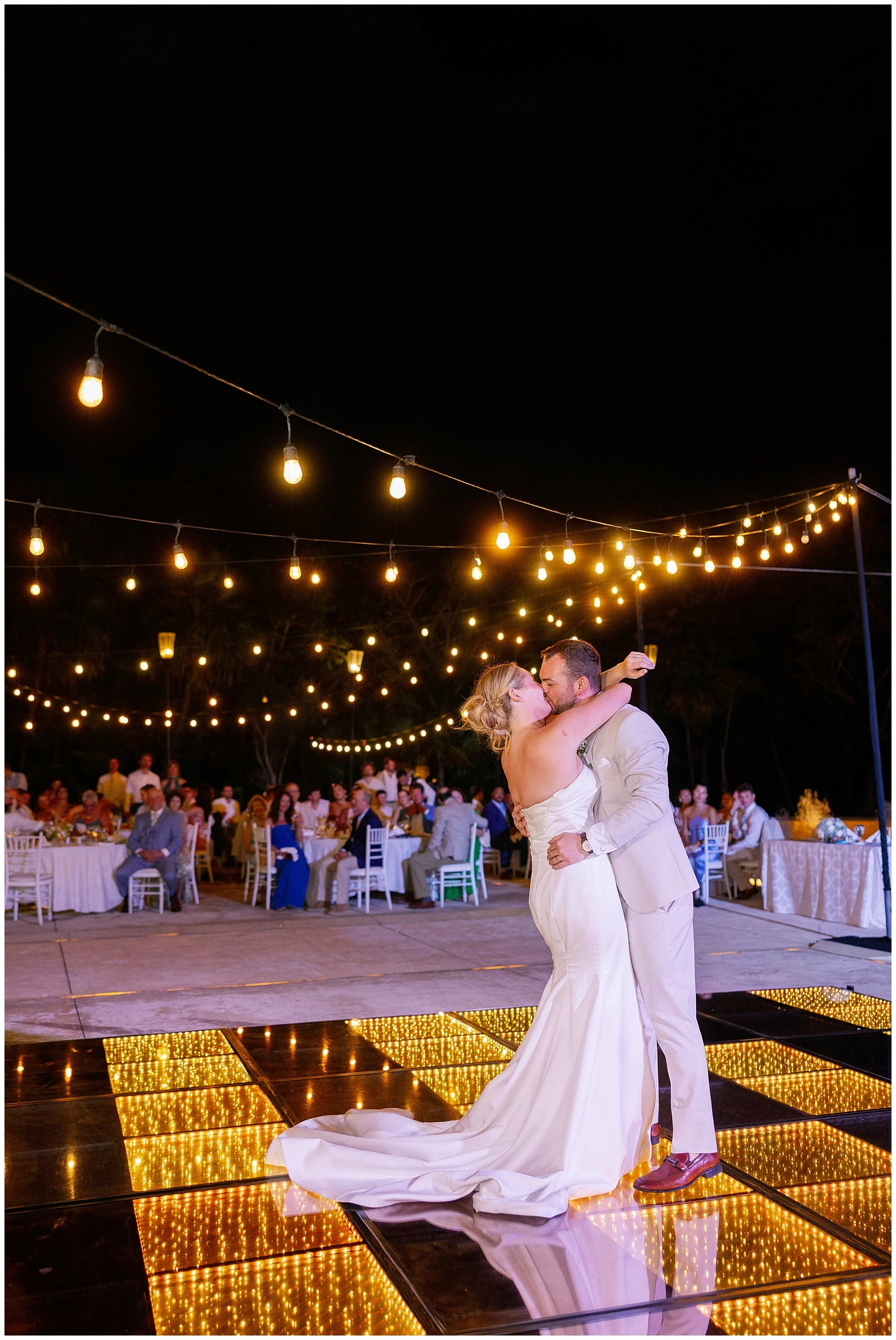  bride and groom kissing on dance floor at valentin imperial resort in riviera maya 