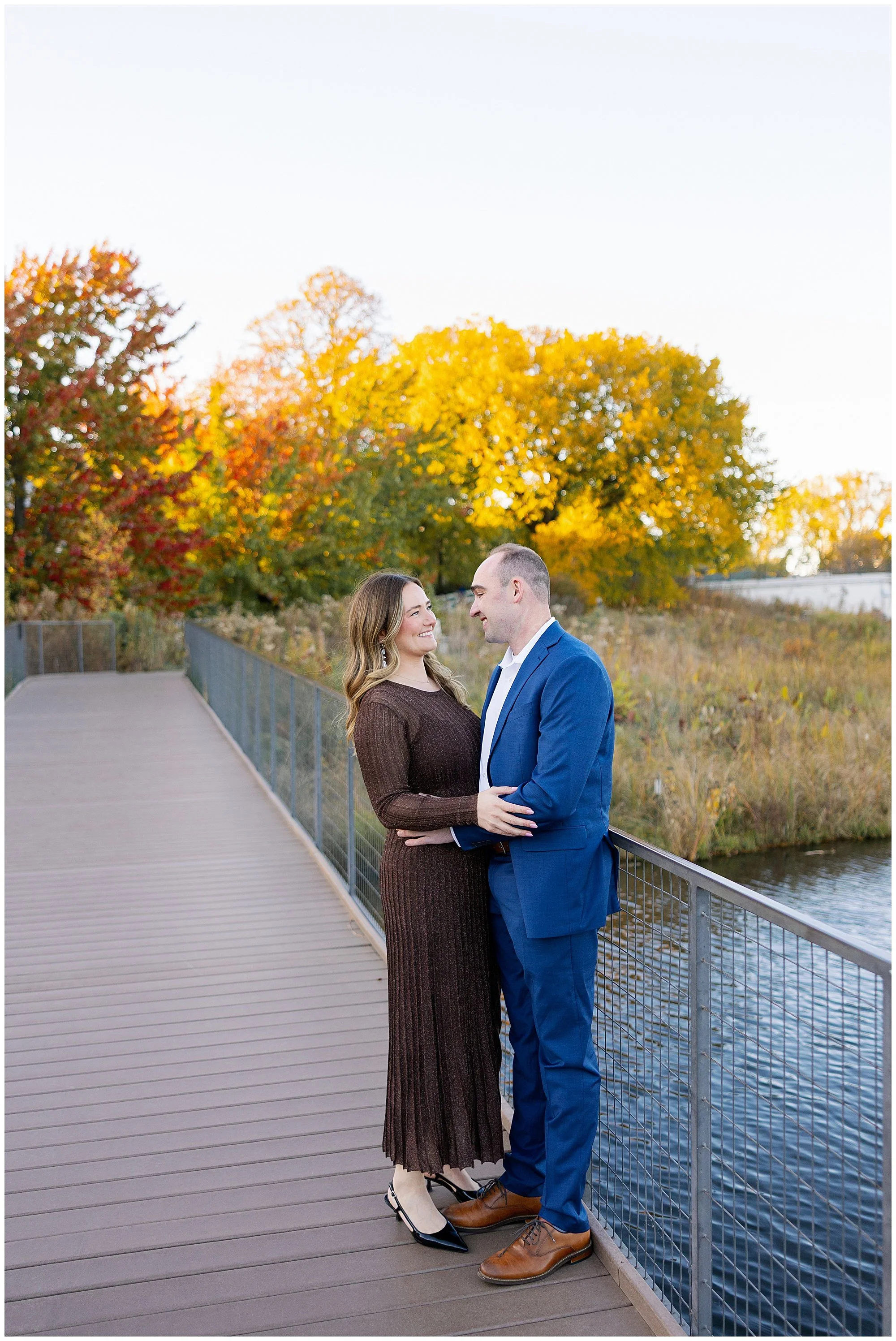  couple looking at each other at nature boardwalk in lincoln park zoo 