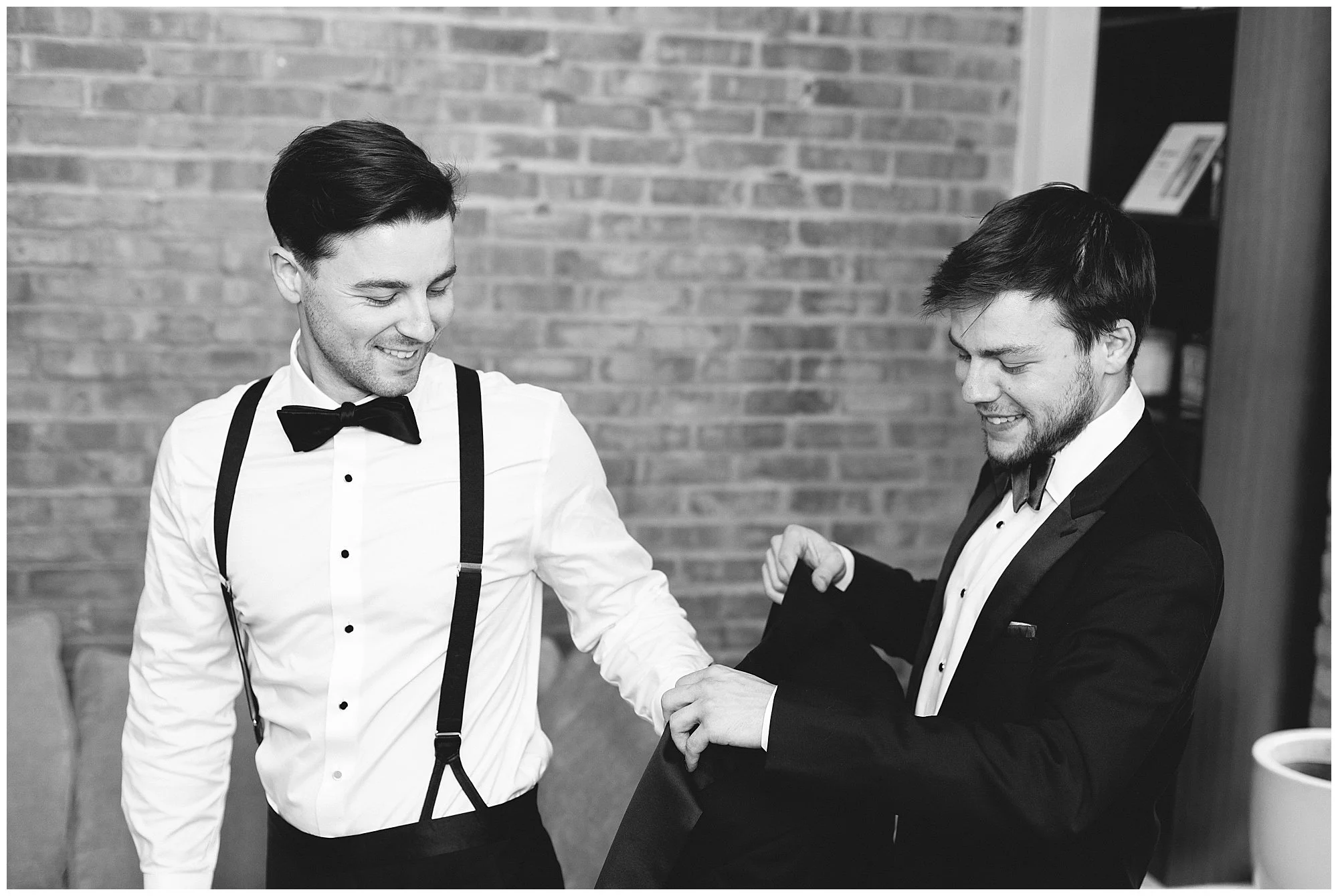  groom putting jacket on before rockwell on the river wedding 