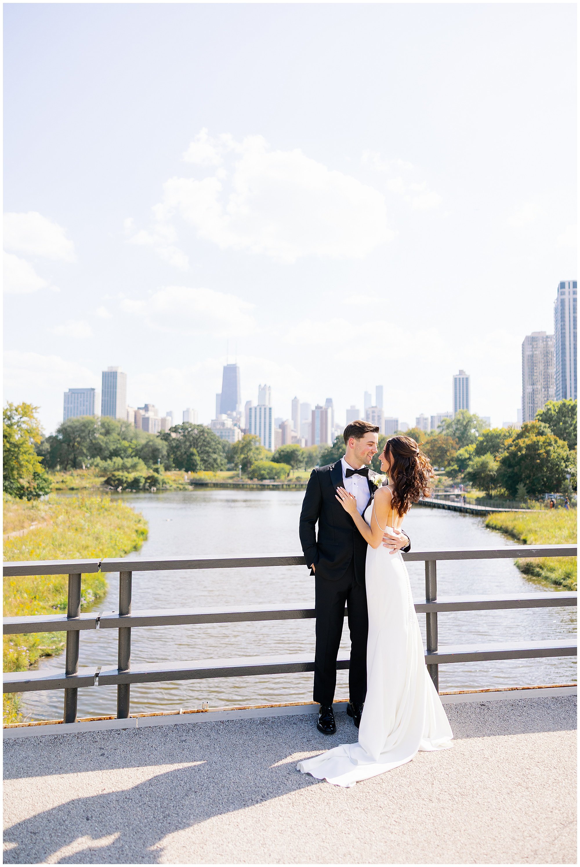  bride and groom looking at each other at lincoln park south pond 
