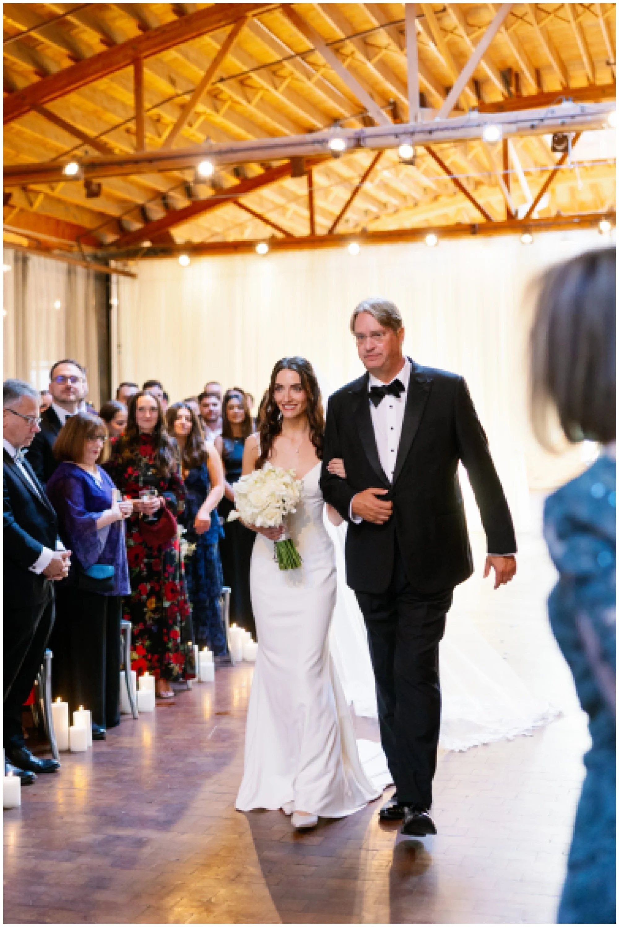  bride with dad walking down aisle for rockwell on the river wedding 