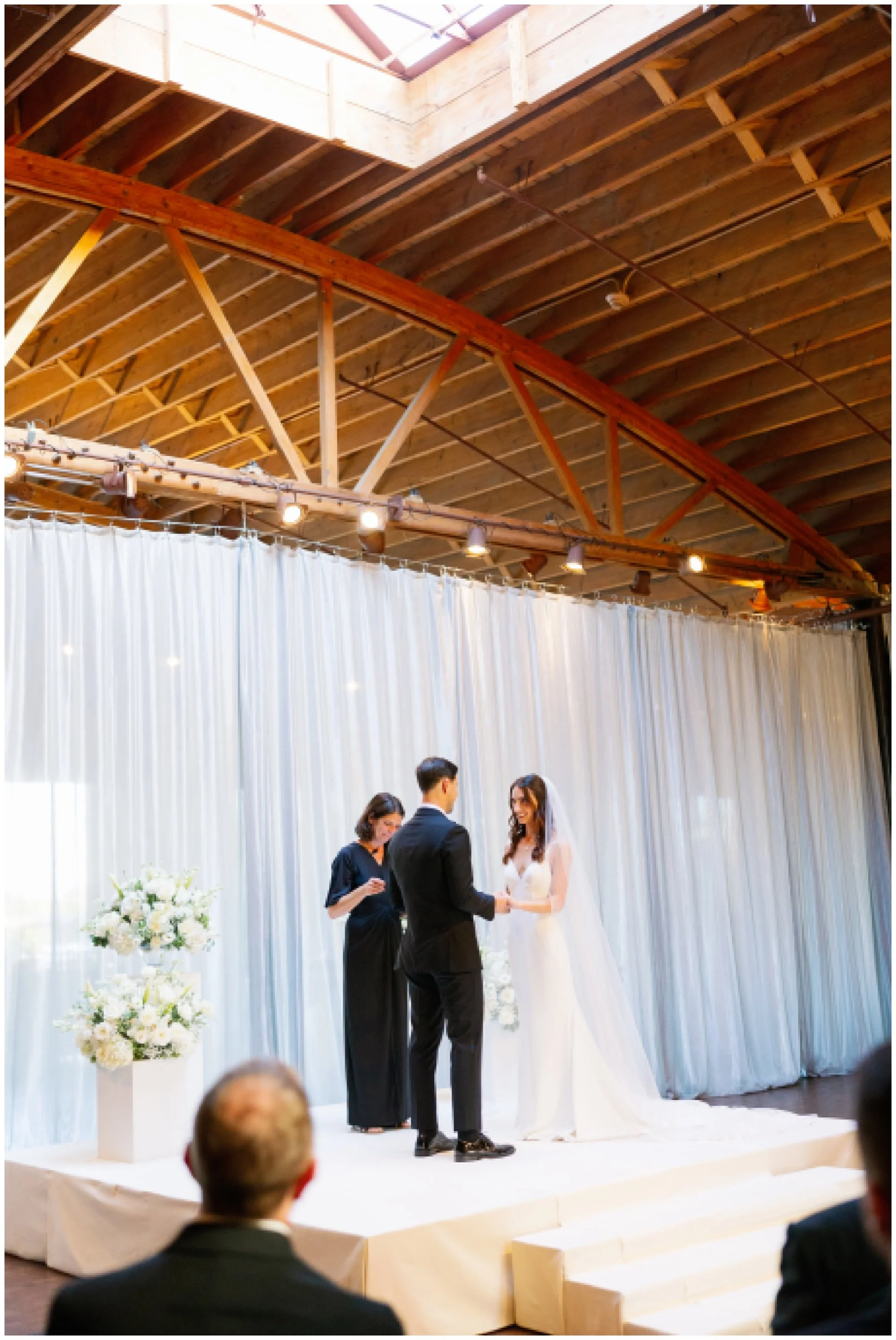  bride and groom at ceremony for rockwell on the river wedding 