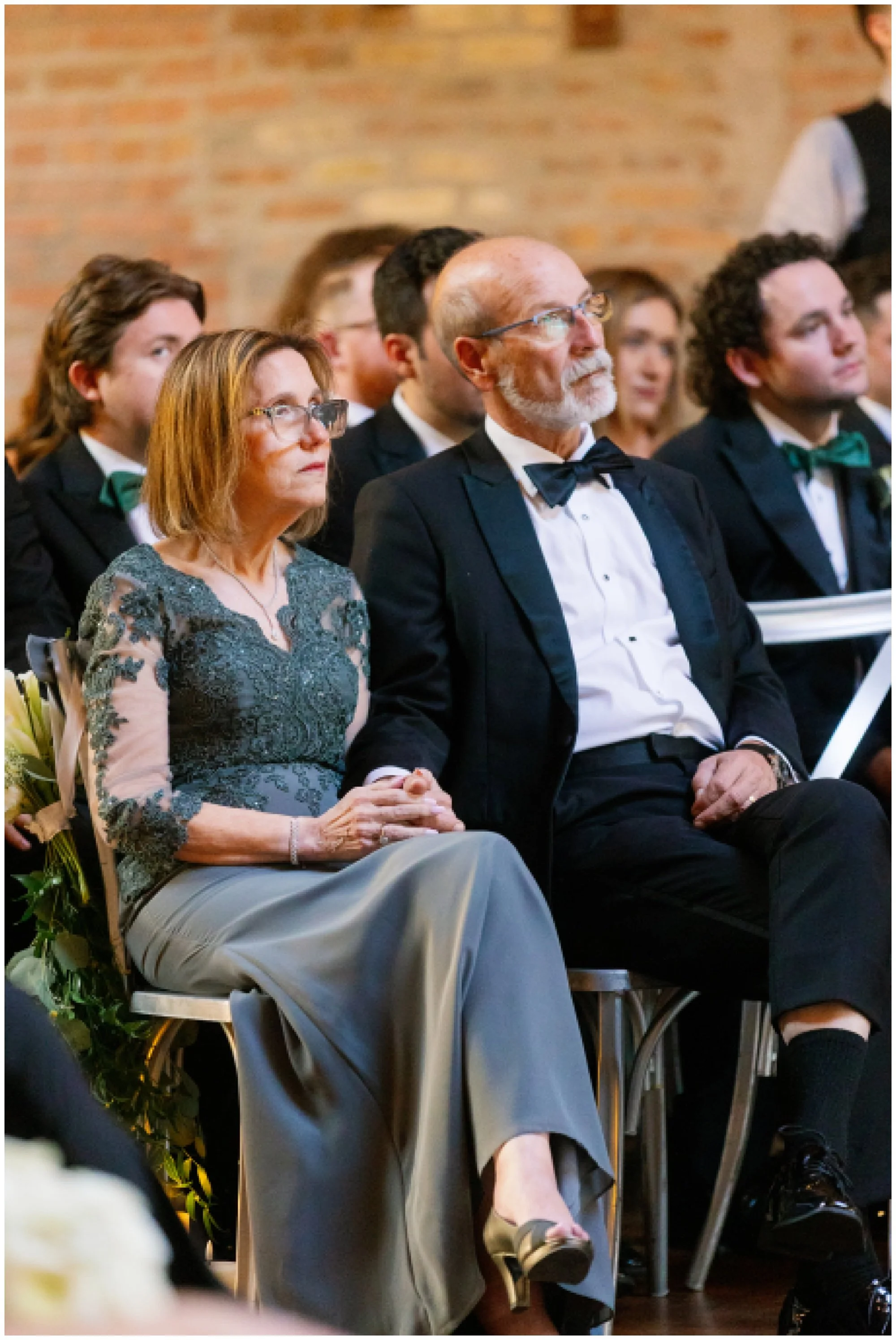  parents watching bride and groom get married at rockwell on the river wedding 