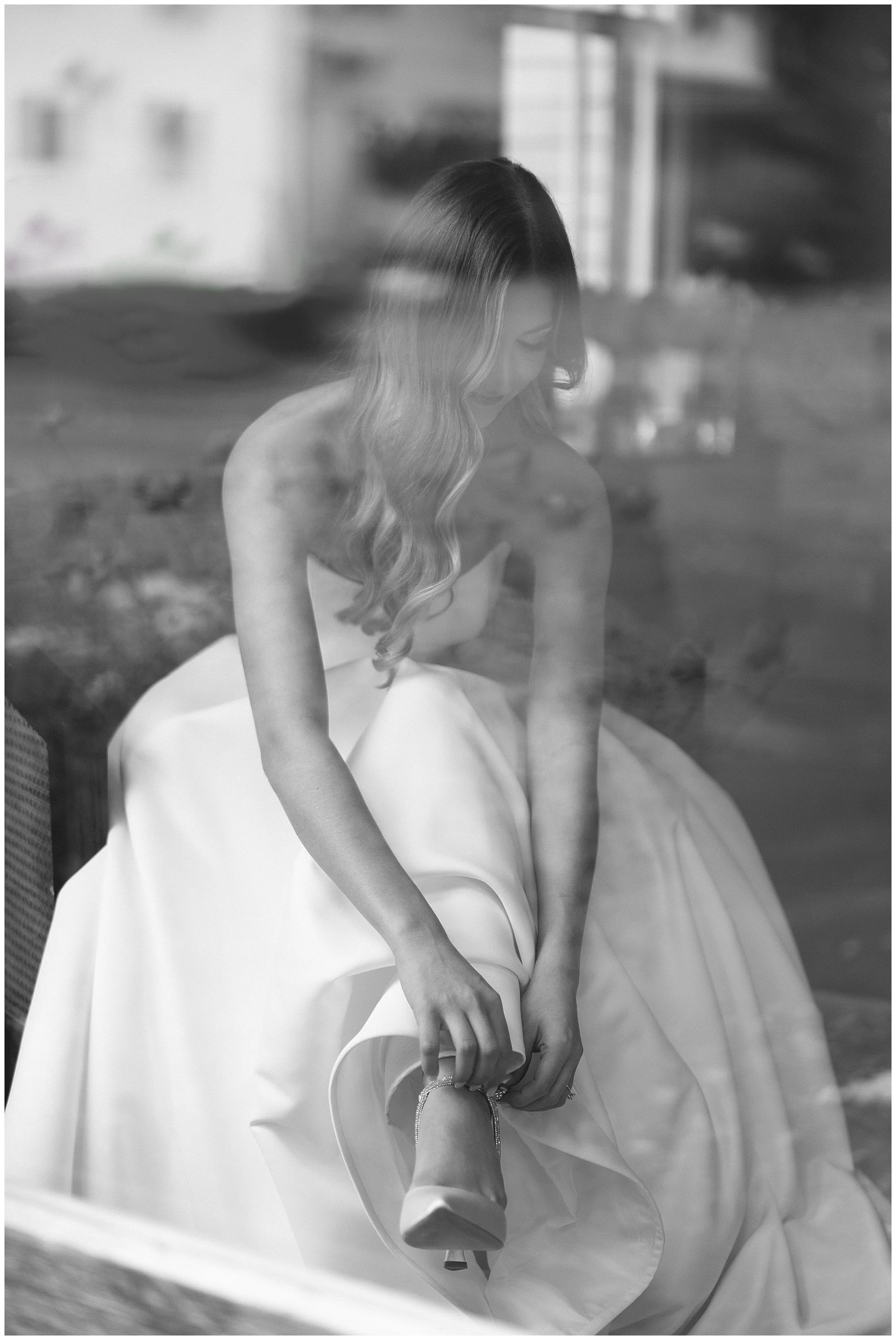  bride putting shoes on for  Mesón Sabika wedding  