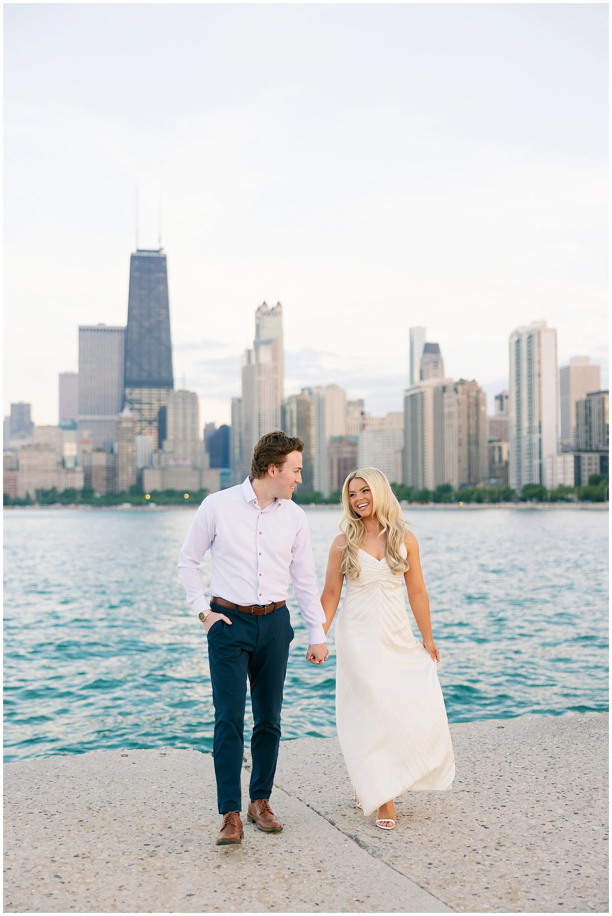  couple walking at north ave beach engagement photos 