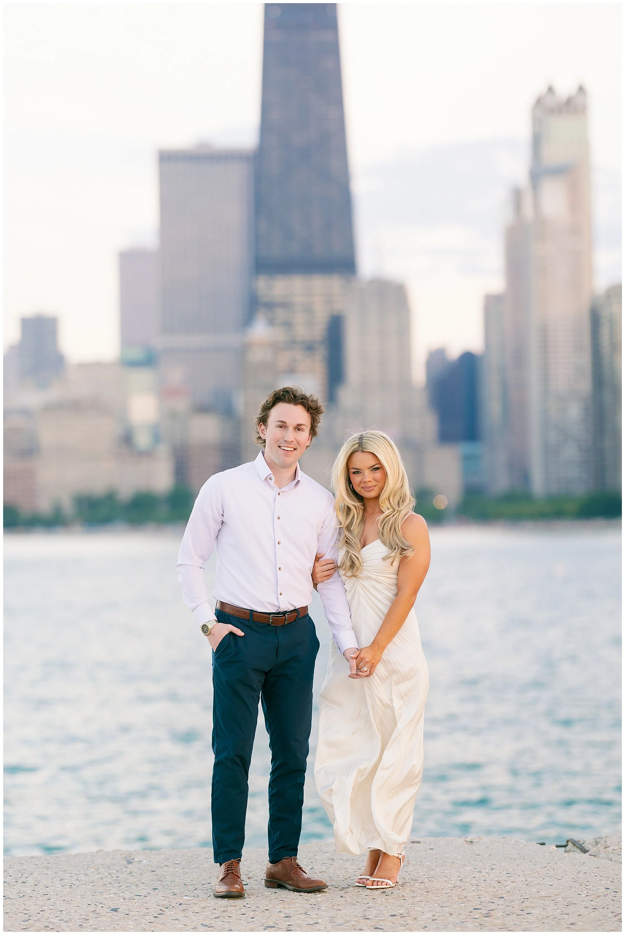  couple smiling at camera for north ave beach engagement photos 