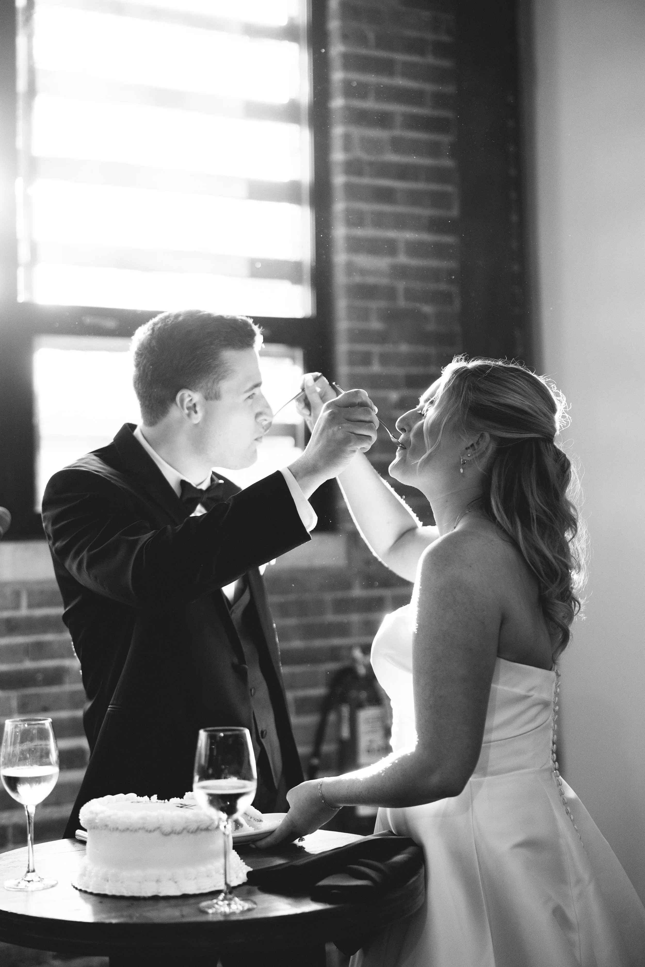 bride and groom eating cake ovation chicago