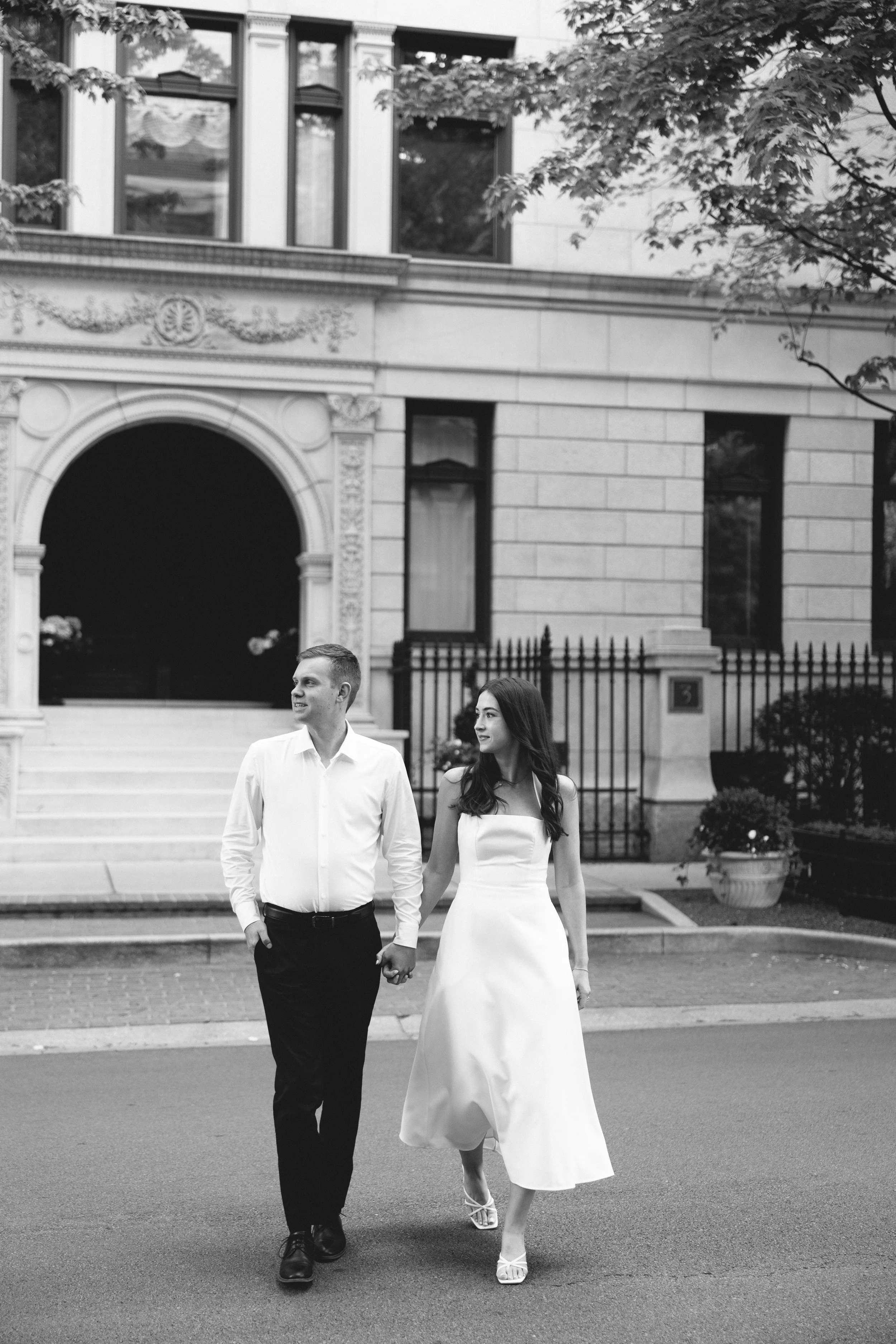lincoln park couple walking across the street engagement photos