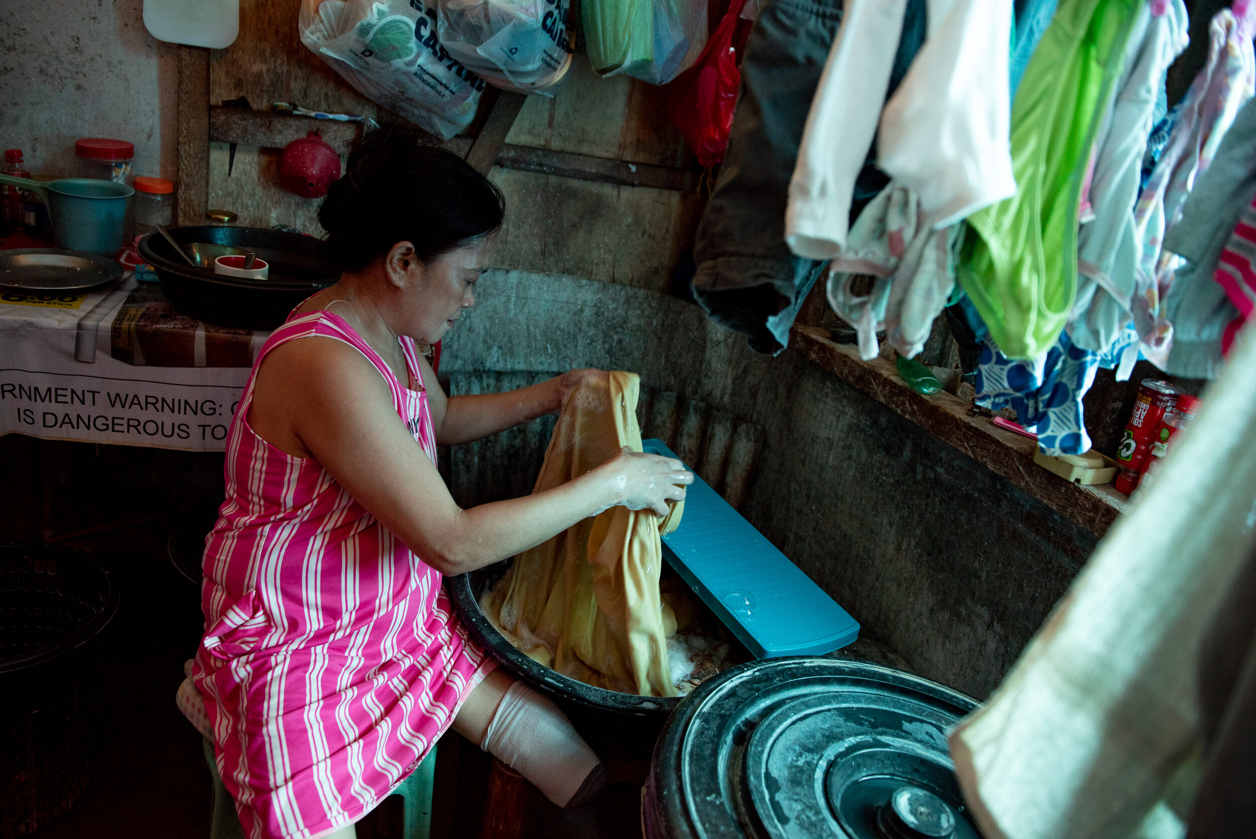  Typhoon Haiyan survivor Lita Estur lost her left leg from an infected wound. She now wears a prosthetic leg to aid her in walking., age 52, lost her left leg from an infected wound. She now wears a prosthetic leg to aid her in walking. 