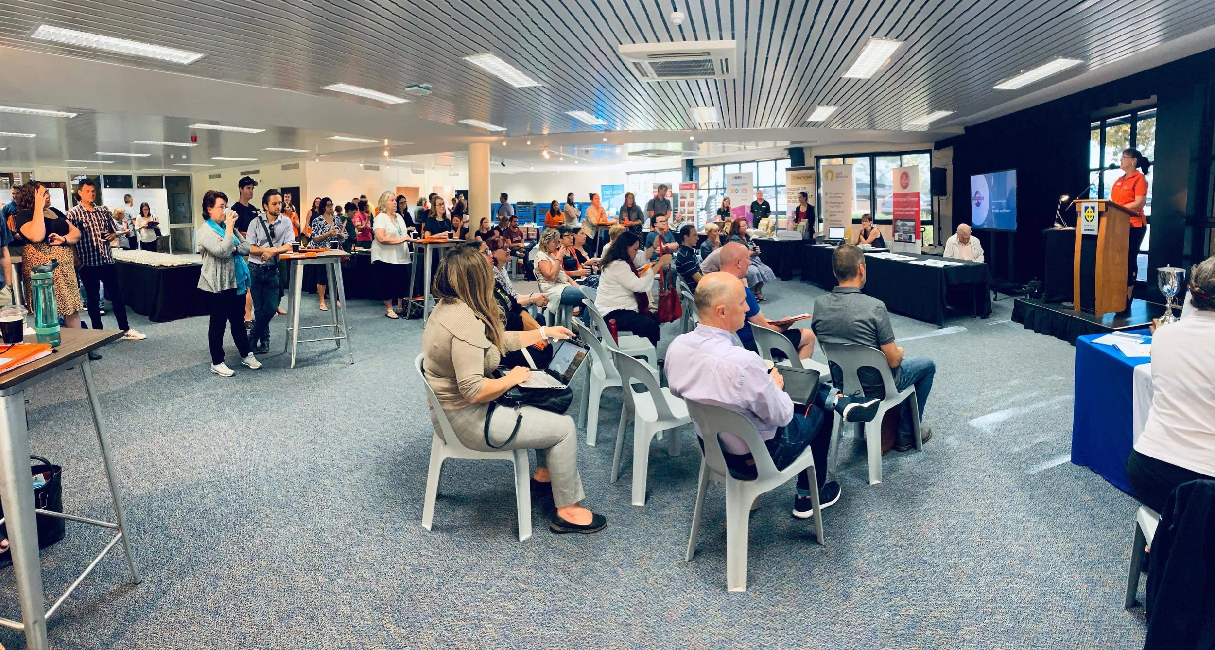  The crowd watches a presentation at the conference, 30 March 2019 