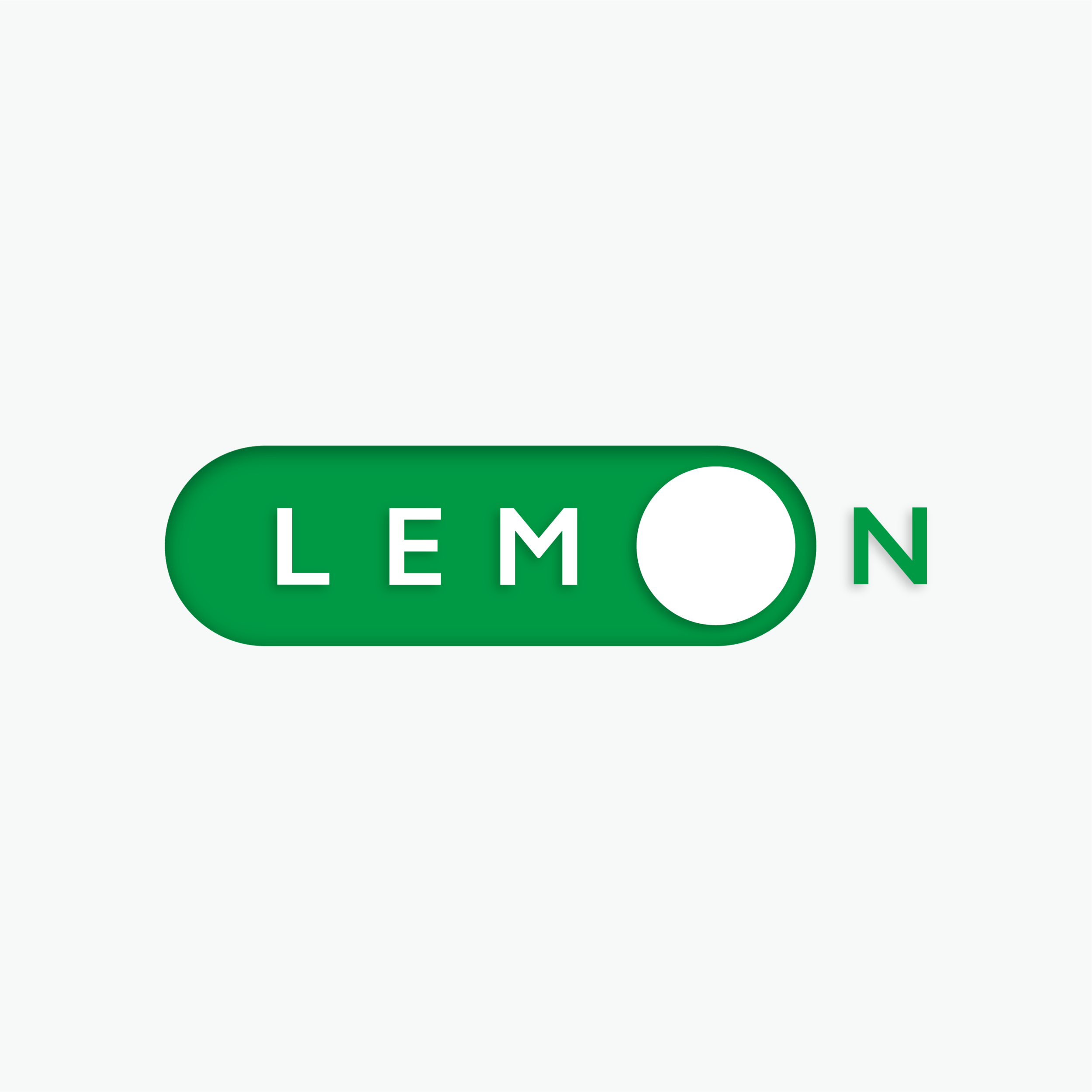 Close-up of a green sign with white text that reads 'LEMON'