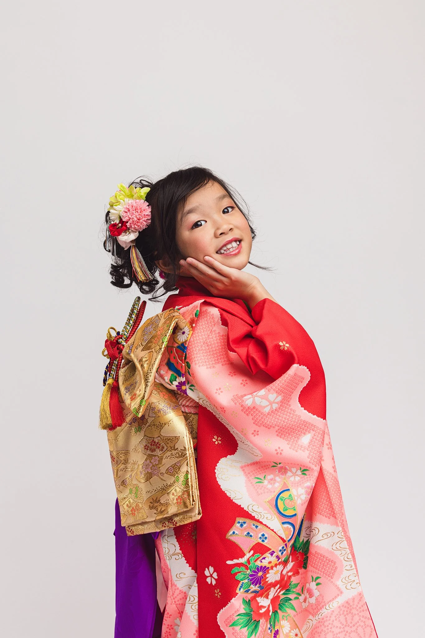Child dressed in a traditional Japanese kimono for a Shichi-Go-San style portrait session in Kirkland, Washington