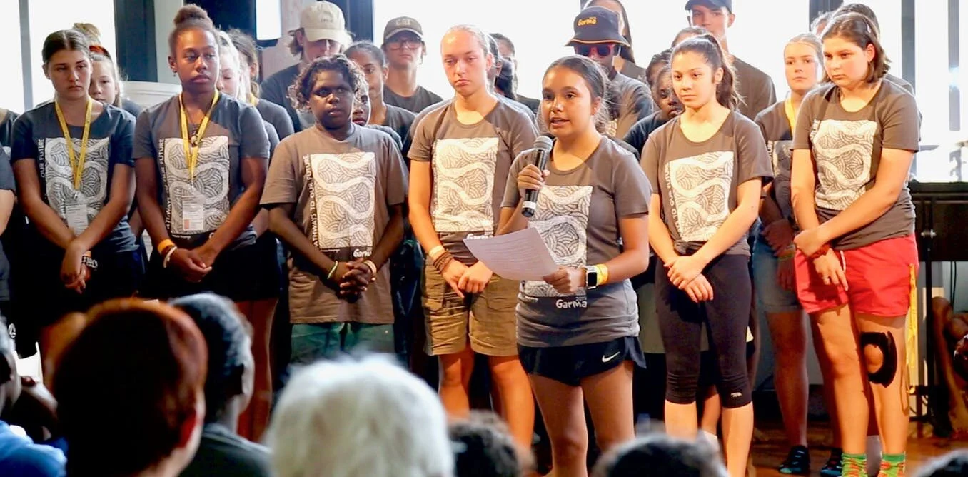 “We are not the problem, we are the solution.” Young Indigenous leaders reading out their powerful Imagination Declaration at the 2019 Garma Festival. (Photo courtesy of The Conversation .)