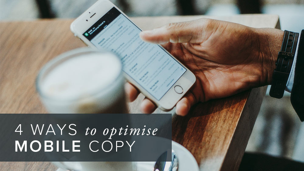 '4+ways+to+optimise+mobile+copy'+over+an+image+of+a+hand+holding+a+mobile+phone.jpg
