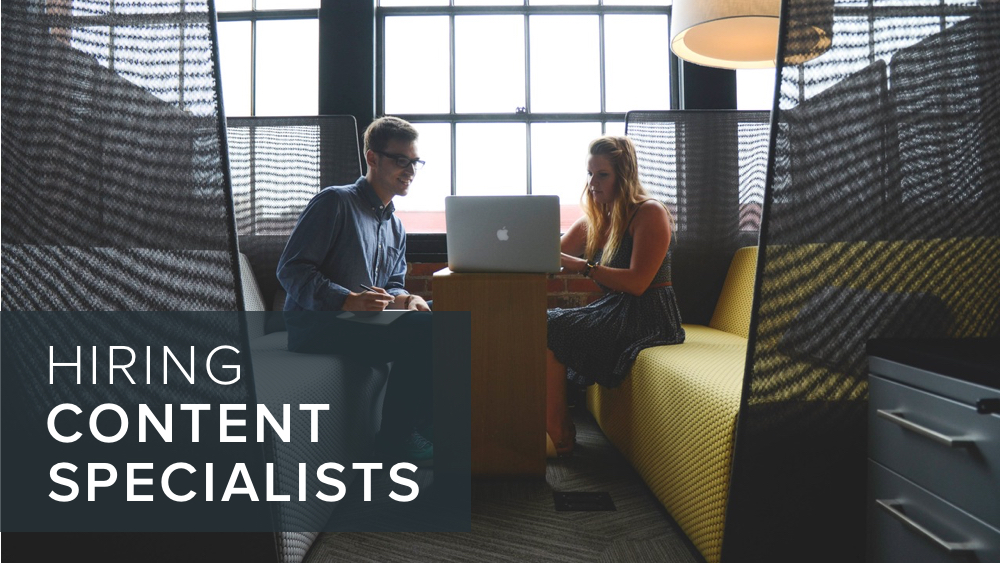 'hiring+content+specialists'+over+image+of+people+discussing+computers.jpg