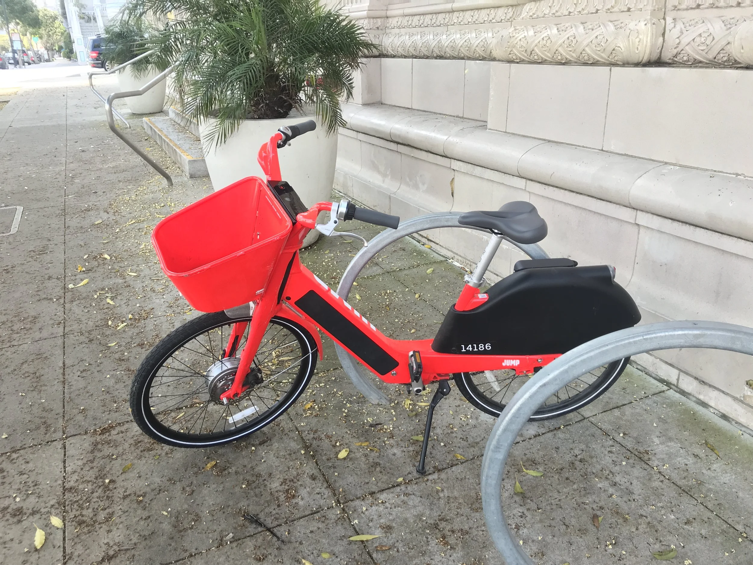The Jump bike’s short locking cable (on the other side of the bike) makes it awkward to park, but great pedal assist and a big basket for stuff made it a fun ride.