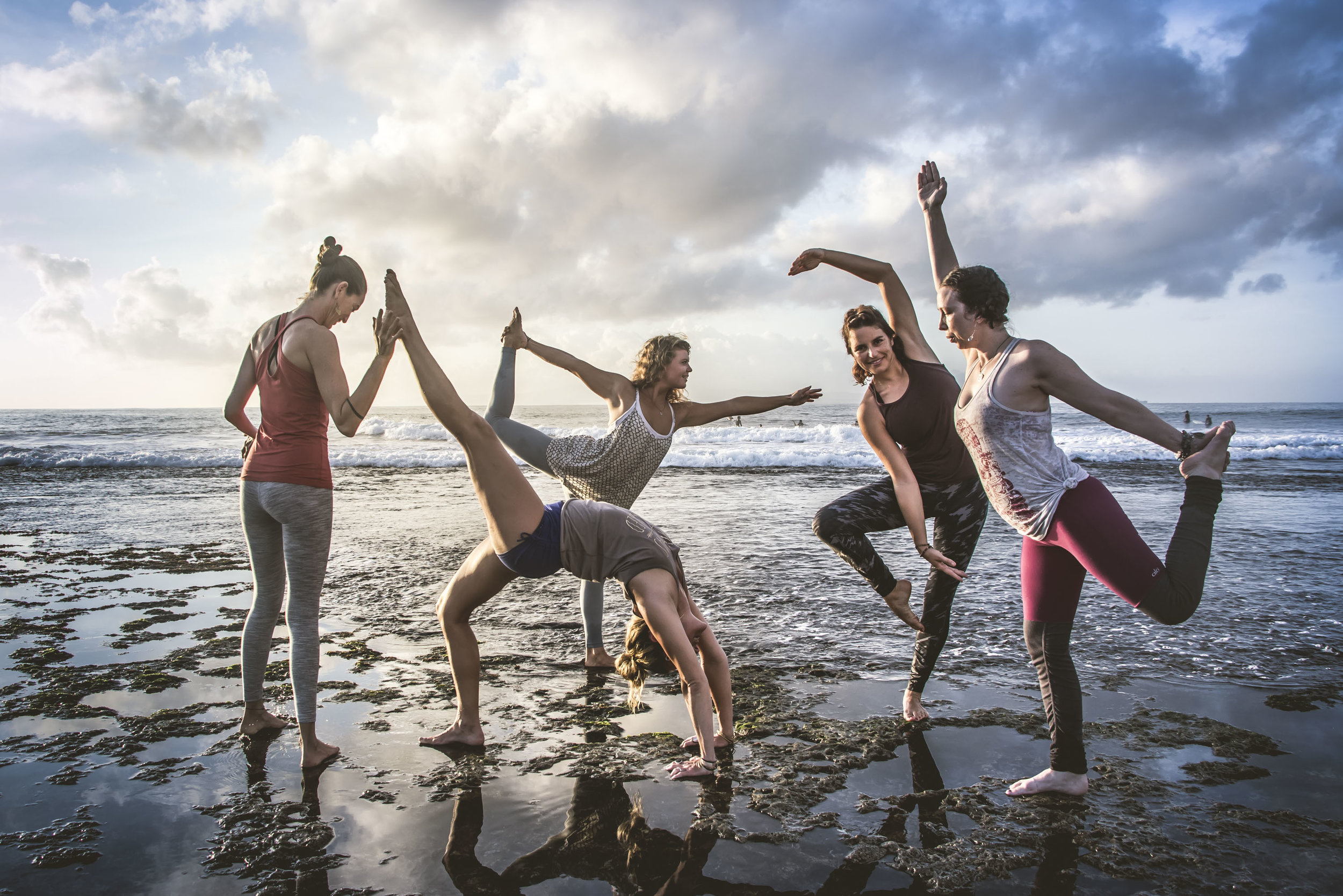 Sattva Yoga Bali instructors performing asanas on the beach (Copy)