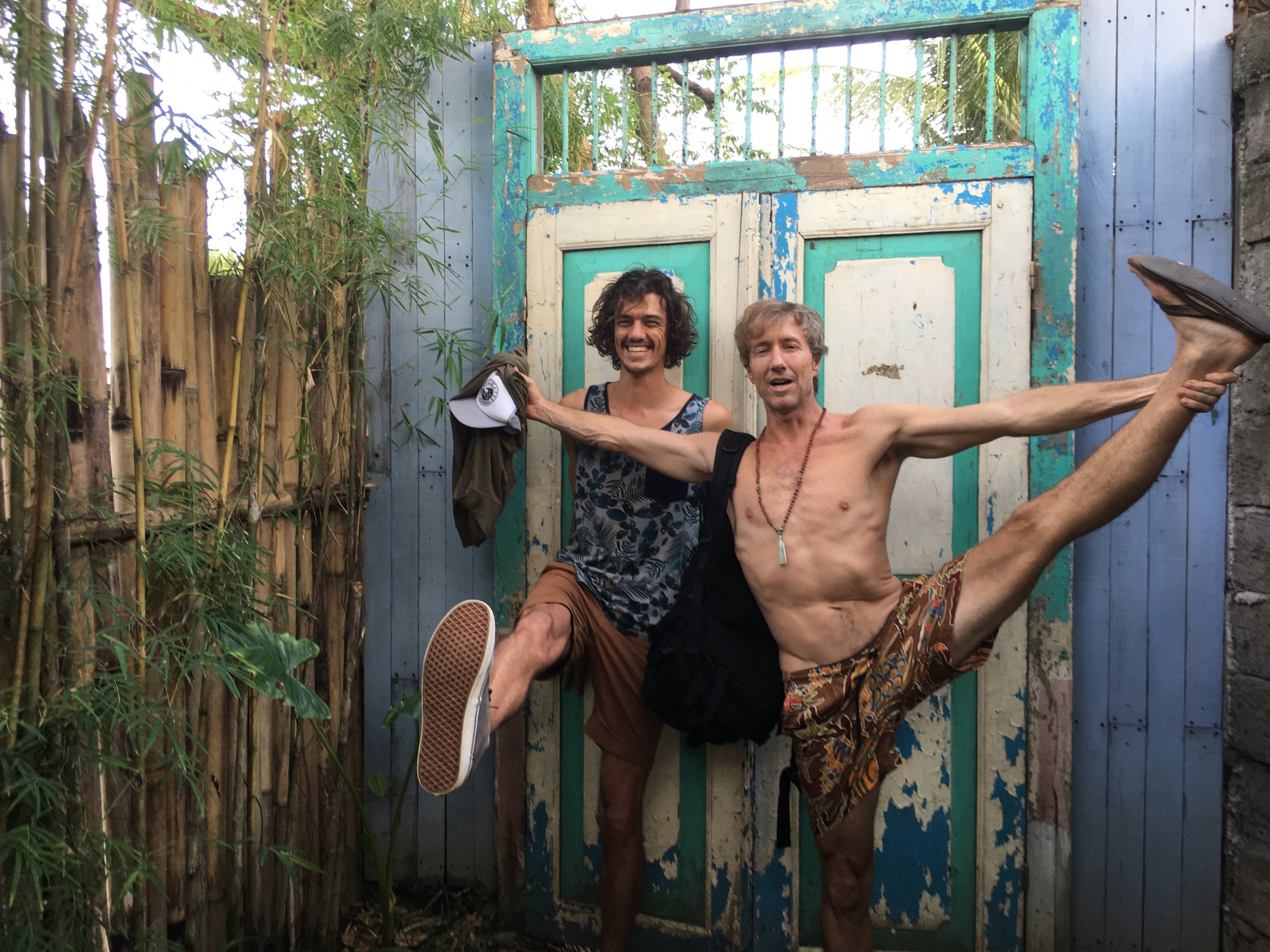 Two students posing outside rustic doors (Copy)