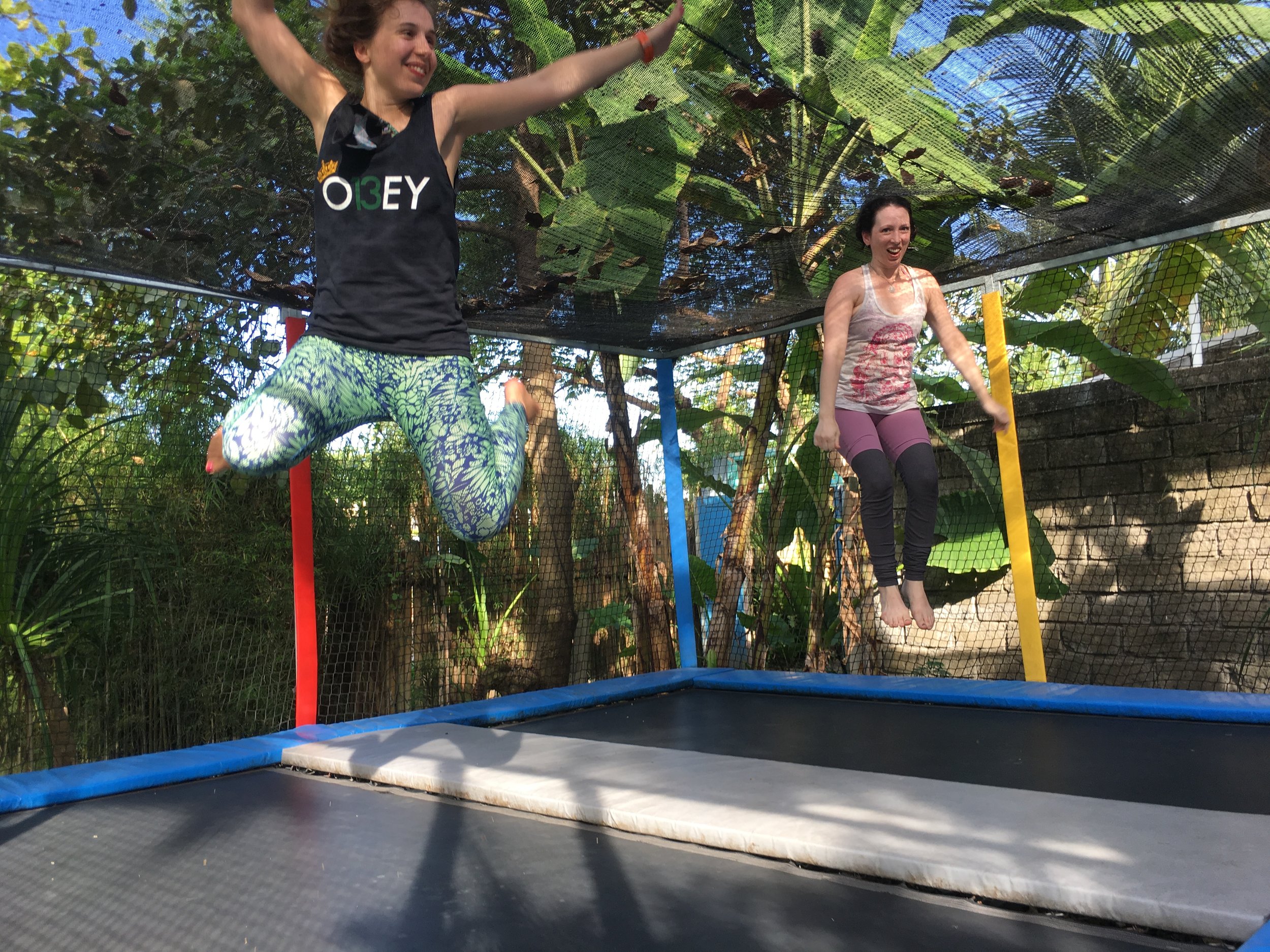 Students bouncing on trampolines at the resort (Copy)