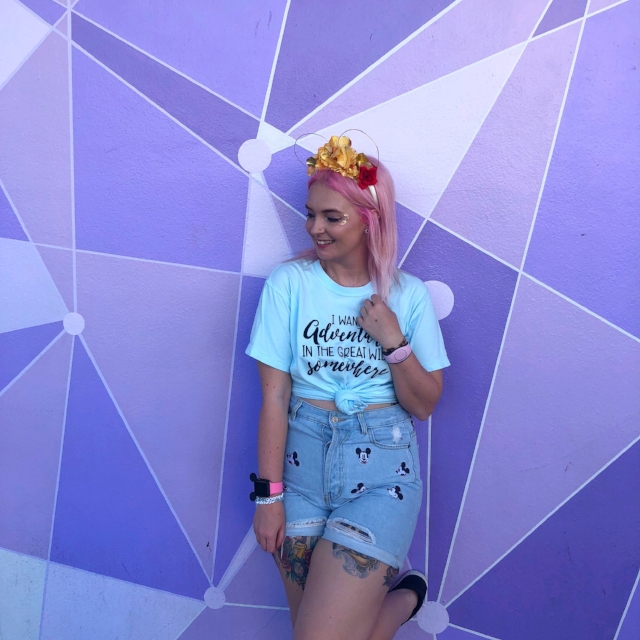 The Most Instagrammable Disney Walls: Girl standing in front of the Galactic Wall at the Magic Kingdom.