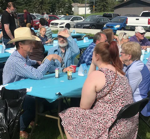 Sitting in the sun chatting with people. This picnic table was in Rutland Park on Sunday July 14.