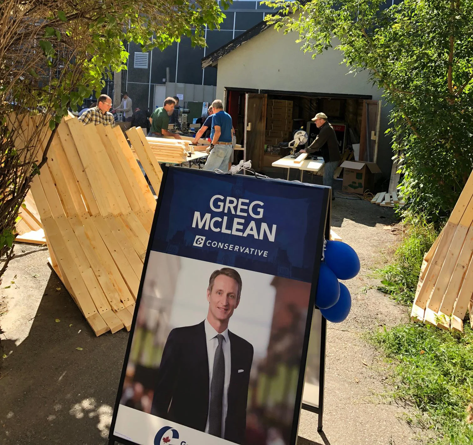 The backyard team of sign constructors. The wooden frames are for the big signs. The campaign manager says that so many 4’x4’ and 4’x8’ signs have been spoken for that we will have to order more!