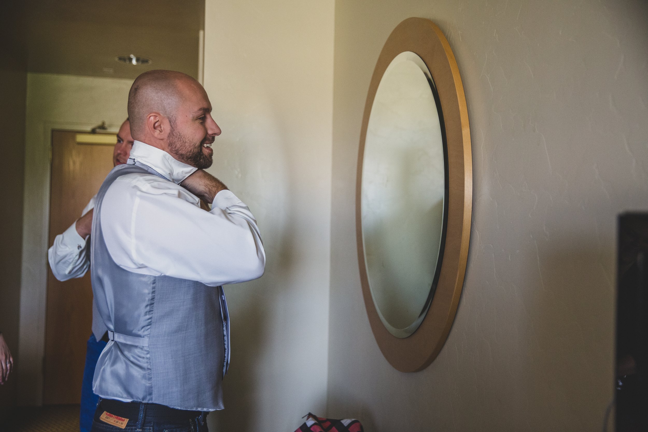  Groom getting ready before his Arizona wedding by Arizona Wedding Photographer Jennifer Lind Schutsky 