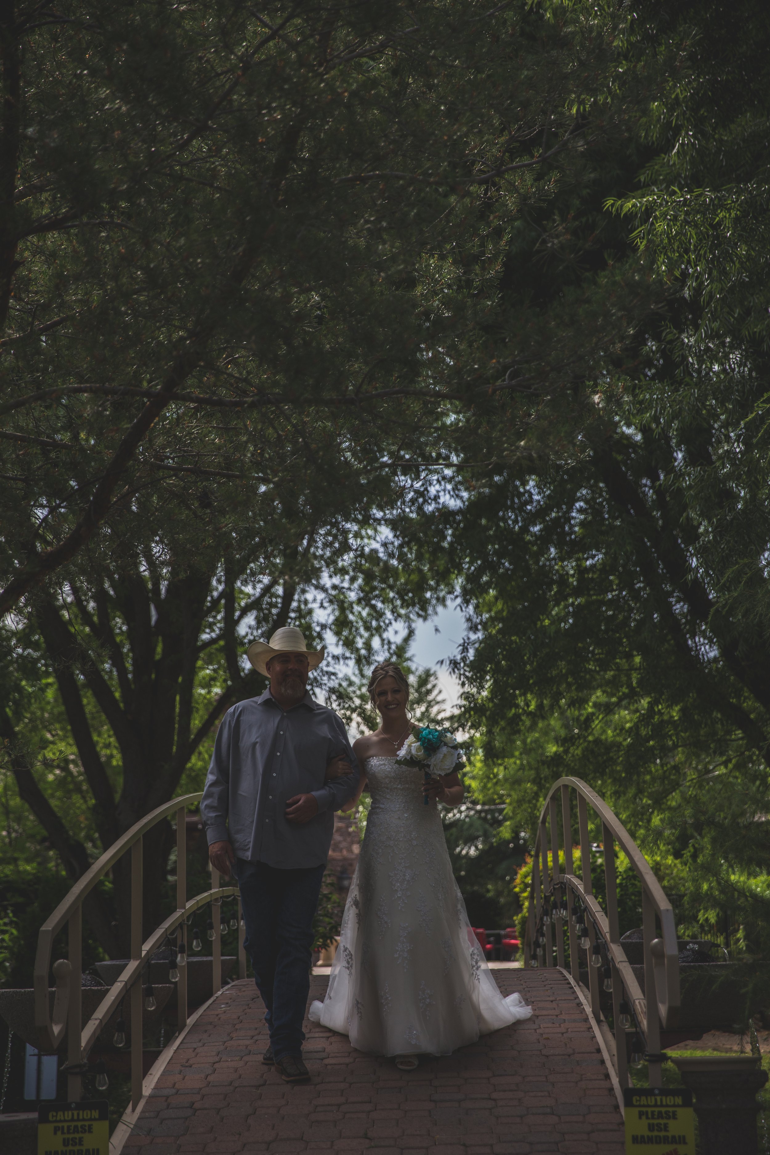  Bride and Groom walking at Arizona wedding by Northern Arizona Wedding Photographer, Jennifer Lind Schutsky.  