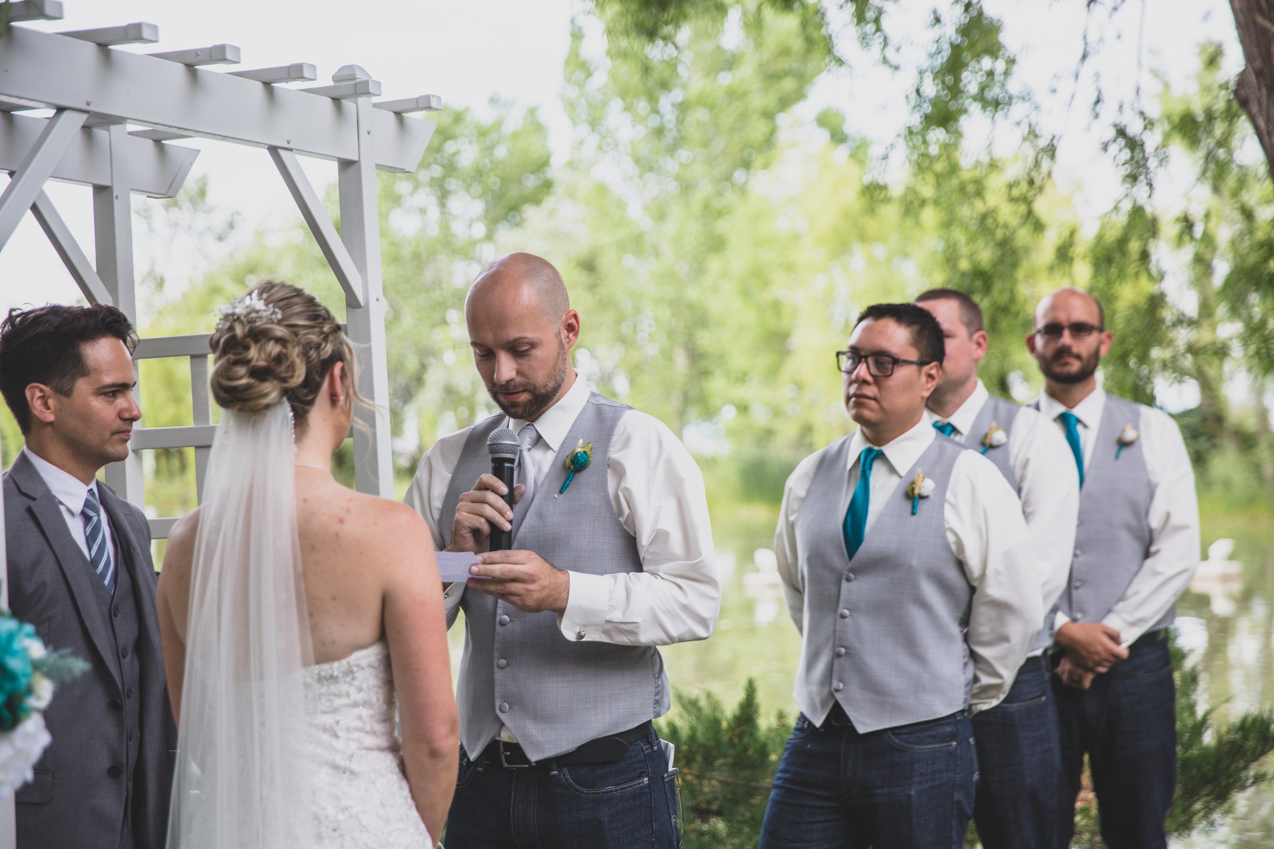  Bride and Groom exchange vows at Arizona wedding by Northern Arizona Wedding Photographer, Jennifer Lind Schutsky.  