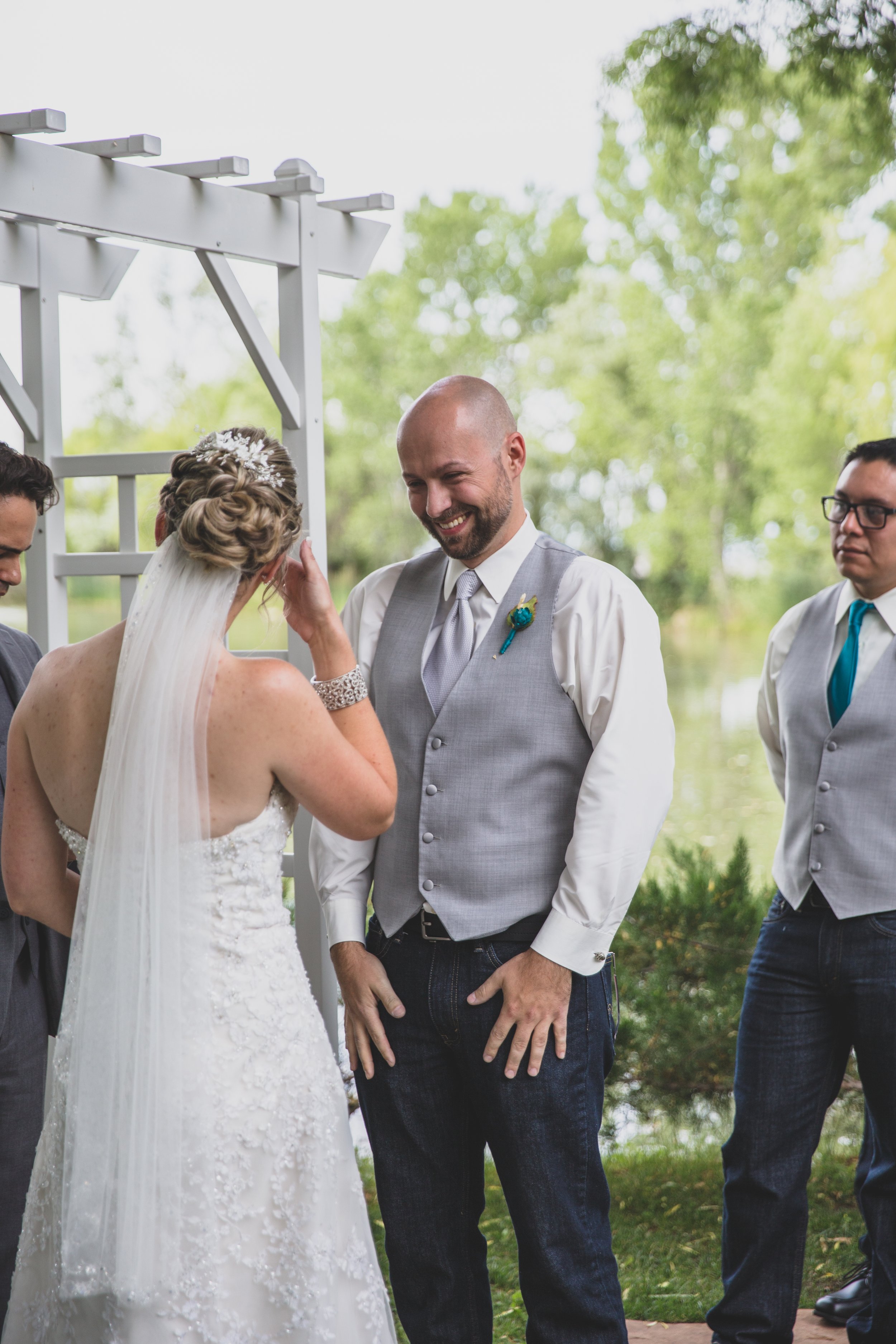  Bride and Groom exchange vows at Arizona wedding by Northern Arizona Wedding Photographer, Jennifer Lind Schutsky.  